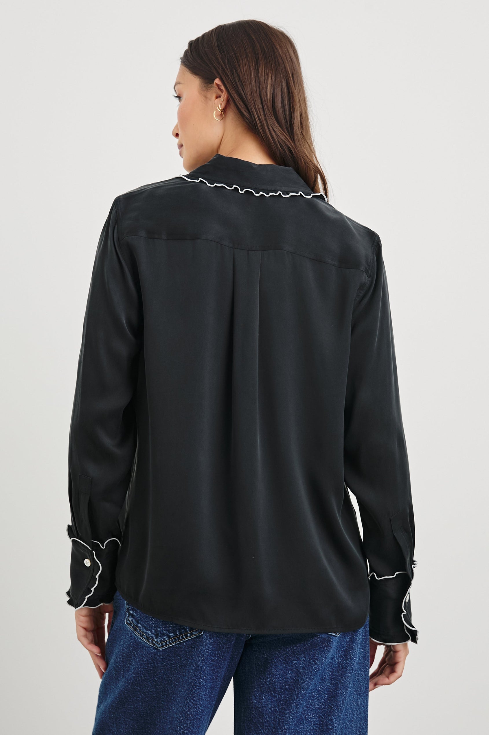 Fia Long-Sleeve Button Up with White Lettuce-Edge Piping on the Collar, Cuffs, and Closure in Black White Piping Colorway - Back View Featured on Model 