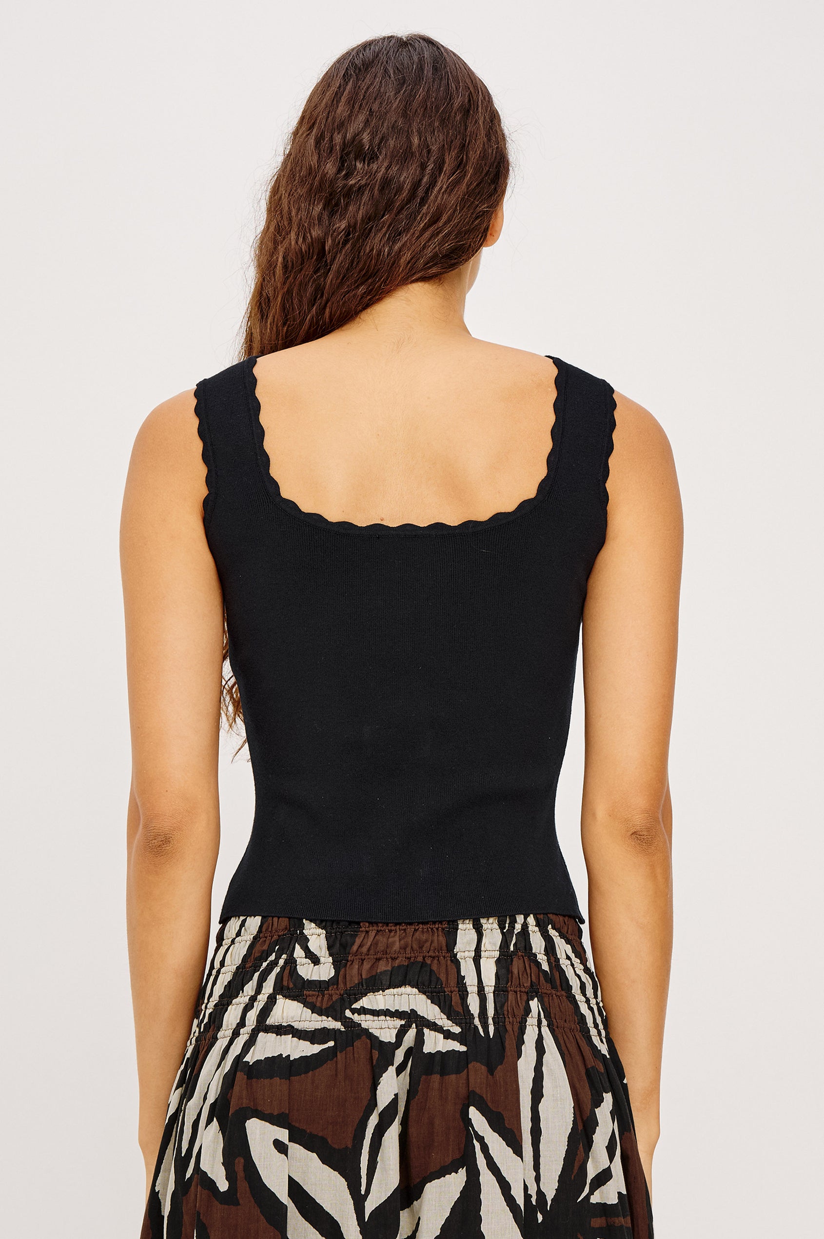 Flore Crop Tank Top in Rib With Scalloped Trim and Soft Square Neckline in Black Colorway - Upper Body Back View Featured on Model
