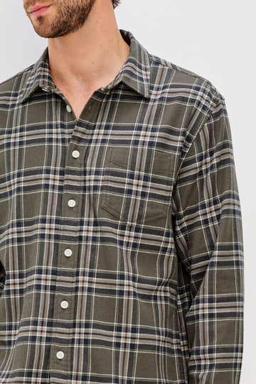 Forrest Long-Sleeve Button Up with a Chest Patch Pocket in Driftwood Coal Colorway, a Brown, Green and Charcoal plaid - Front Detail View Featured on Model