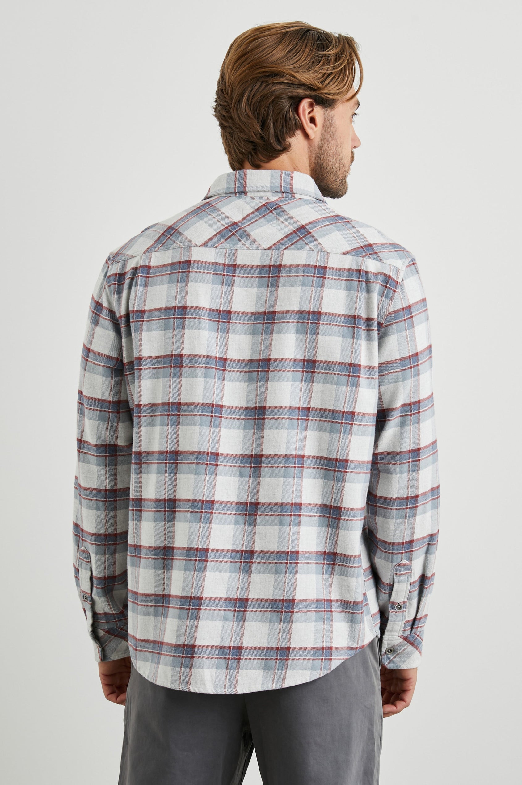 Forrest Long-Sleeve Button Up with a Chest Patch Pocket in Moab Sky Melange Colorway, a plaid in Cream, Blue and Maroon - Back View Featured on Model