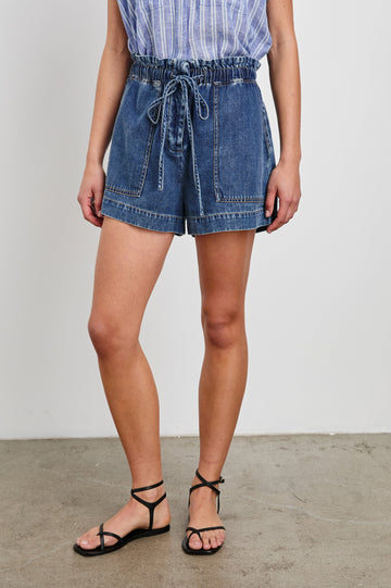 Foster Shorts with Paperbag Drawstring Waist, Large Front Pockets and Decorative Back Pockets in Classic Blue Colorway - Front View Featured on Model
