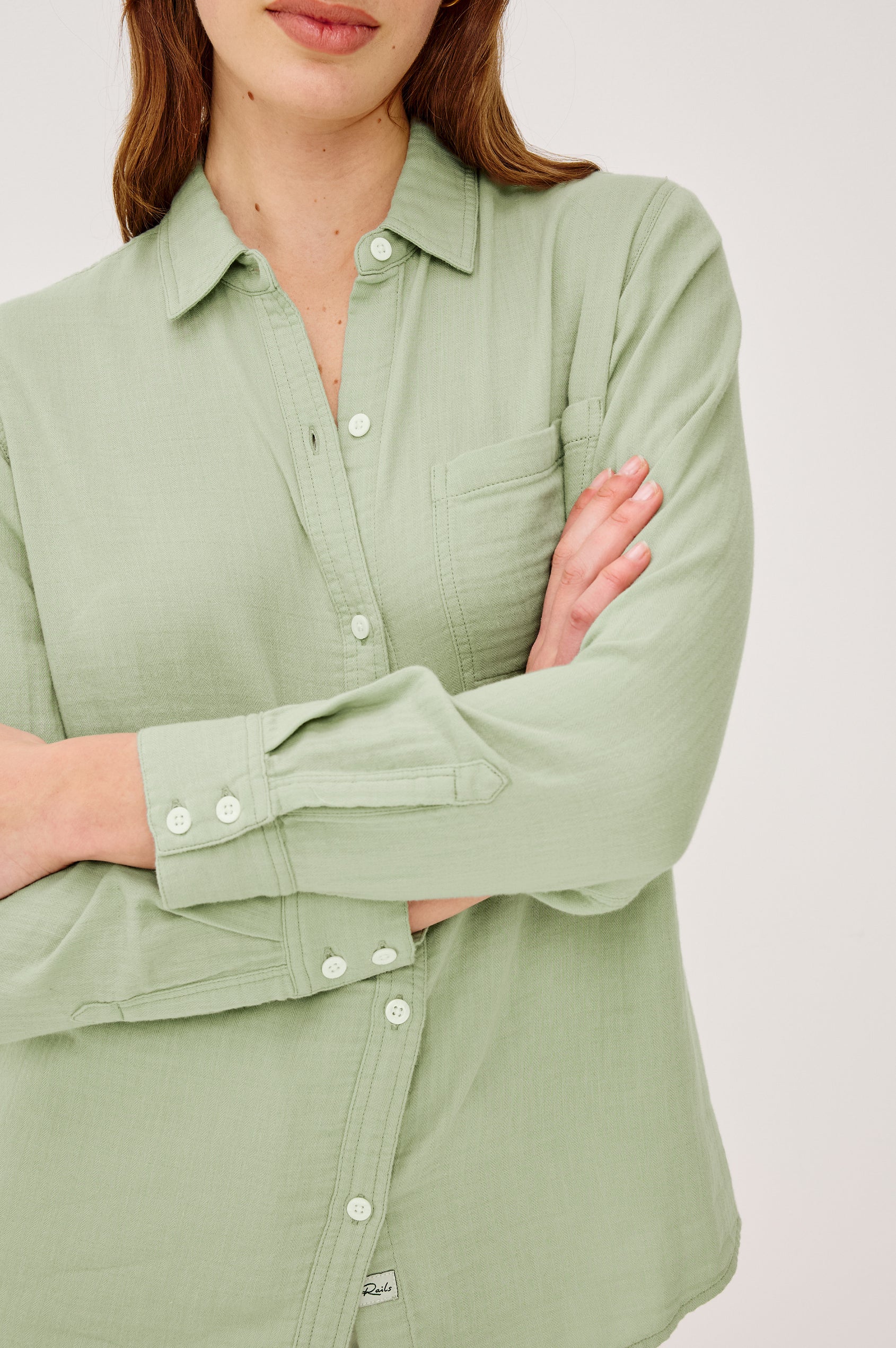 Freeman Button-Up Collared Shirt With Subtle Herringbone Texture Relaxed FIt Chest Patch Pockets and Long Sleeves in Vintage Sage Colorway - Upper Body Front View Featured on Model