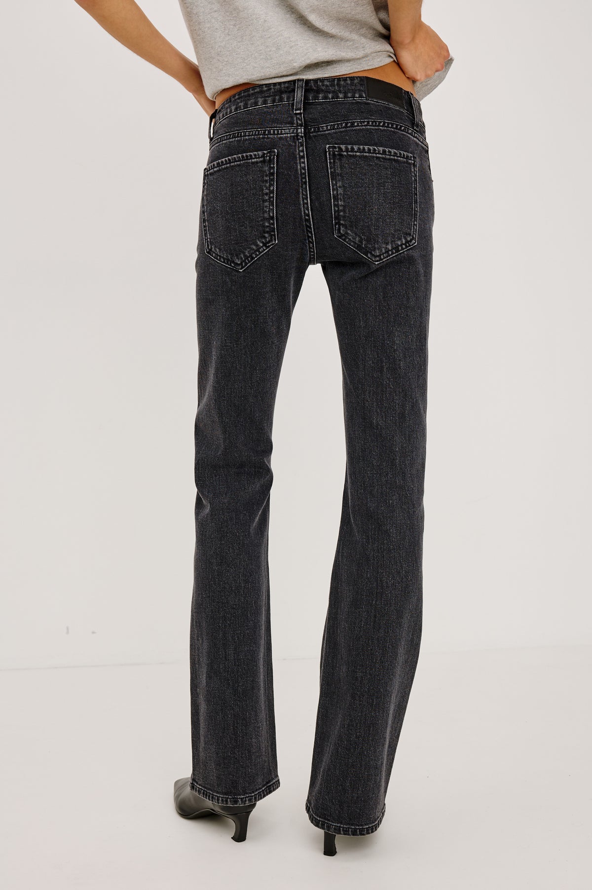 Fremont Low Rise Bootcut Jean in Light Stretch Denim With Extended Inseam, 5-Pockets, Belt Loops, and Zip-Fly Closure in Blackjack Colorway - Lower Body Back View Featured on Model