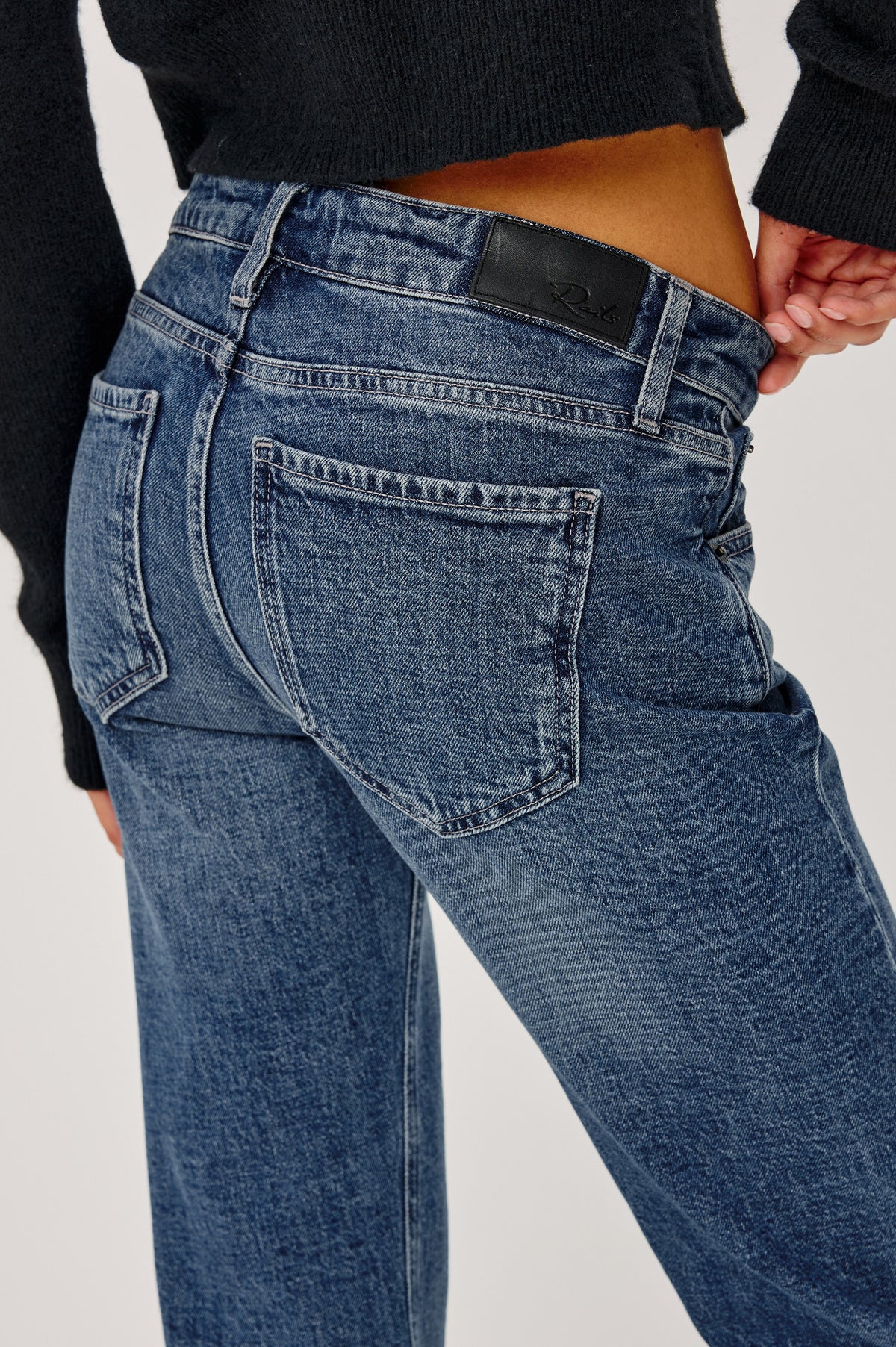 Fremont Low Rise Bootcut Jean in Light Stretch Denim With Extended Inseam, 5-Pockets, Belt Loops, and Zip-Fly Closure in Blue Haven Colorway - Upper Body Front Detail View Featured on Model.