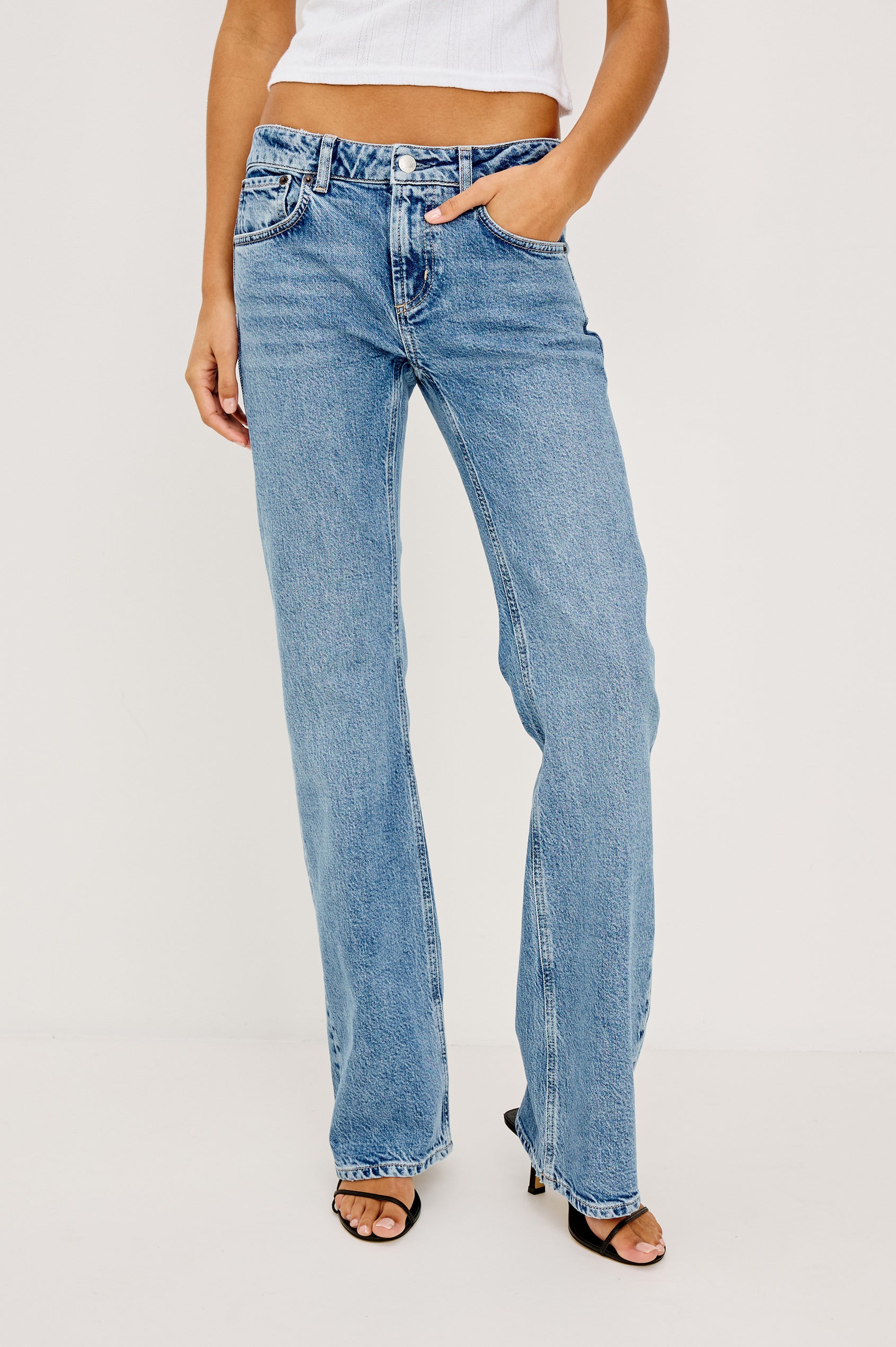 Fremont Bootcut Jean in Light Stretch Denim With 5-Pockets, Zip Fly, and 32″ Inseam in Old Indigo Colorway - Lower Body Front View Featured on Model