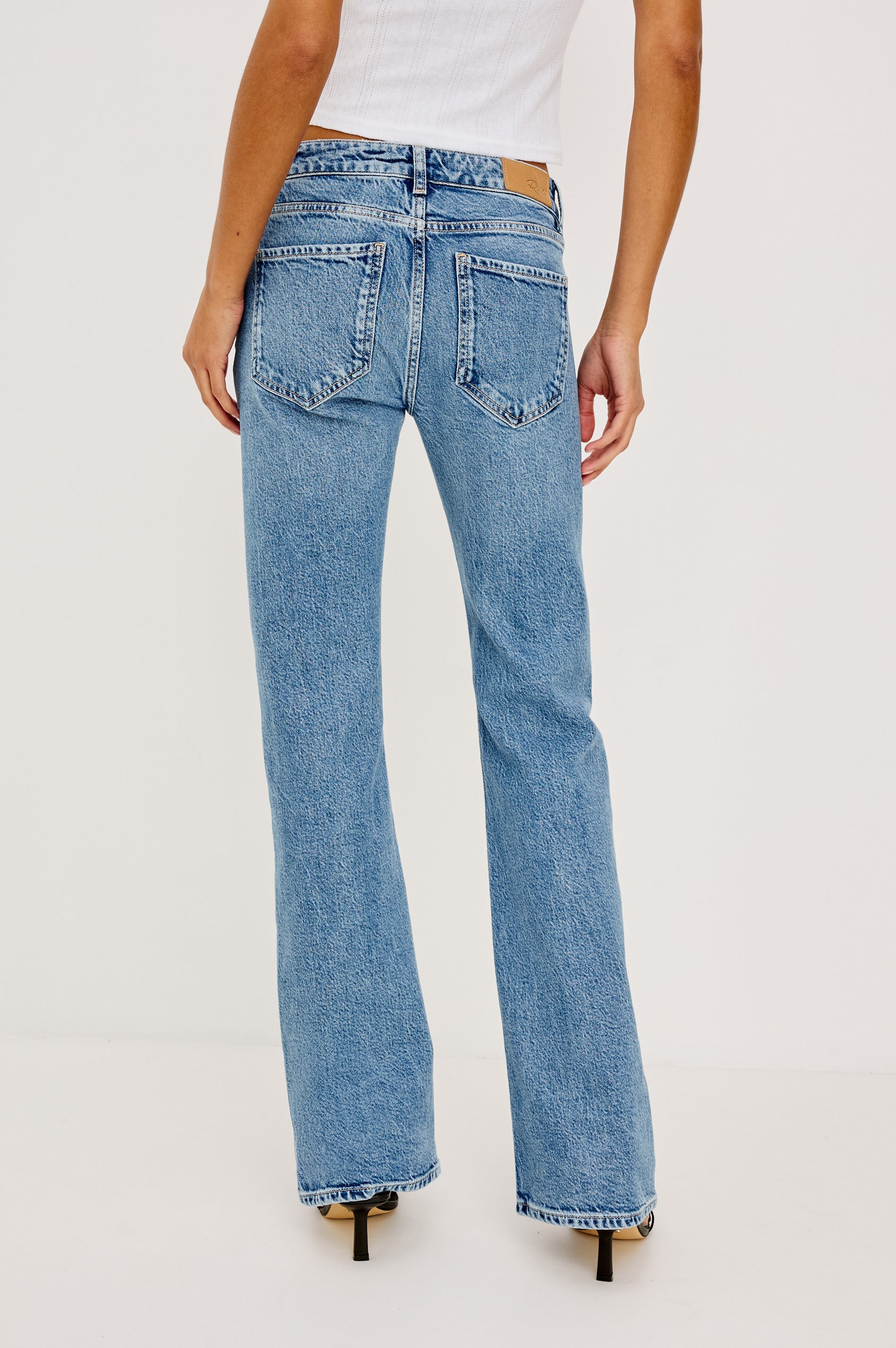 Fremont Bootcut Jean in Light Stretch Denim With 5-Pockets, Zip Fly, and 32″ Inseam in Old Indigo Colorway - Lower Body Back View Featured on Model