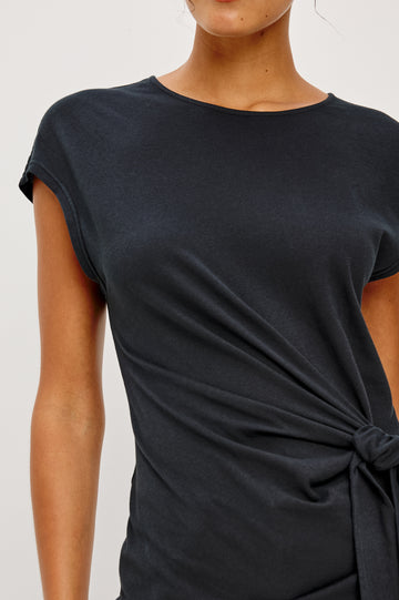 Gabbie Top in Cotton With Boat Neckline Dolman Cap Sleeves and Waist Wrap Ties in Black Colorway - Upper Body Close Up Front View Featured on Model