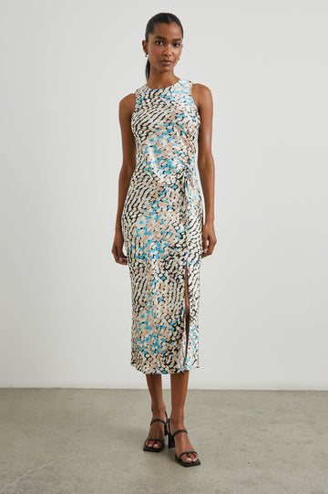 Gabriella Sleeveless Midi Dress with a Crew Neck, a Left Thigh Side Slit, a Ruched Drawstring on the Left Side and a Keyhole Button Closure at the Back in Andorra Colorway, Ovals in Blue, Browns and Cream on Black - Front Full Body View Featured on Model 