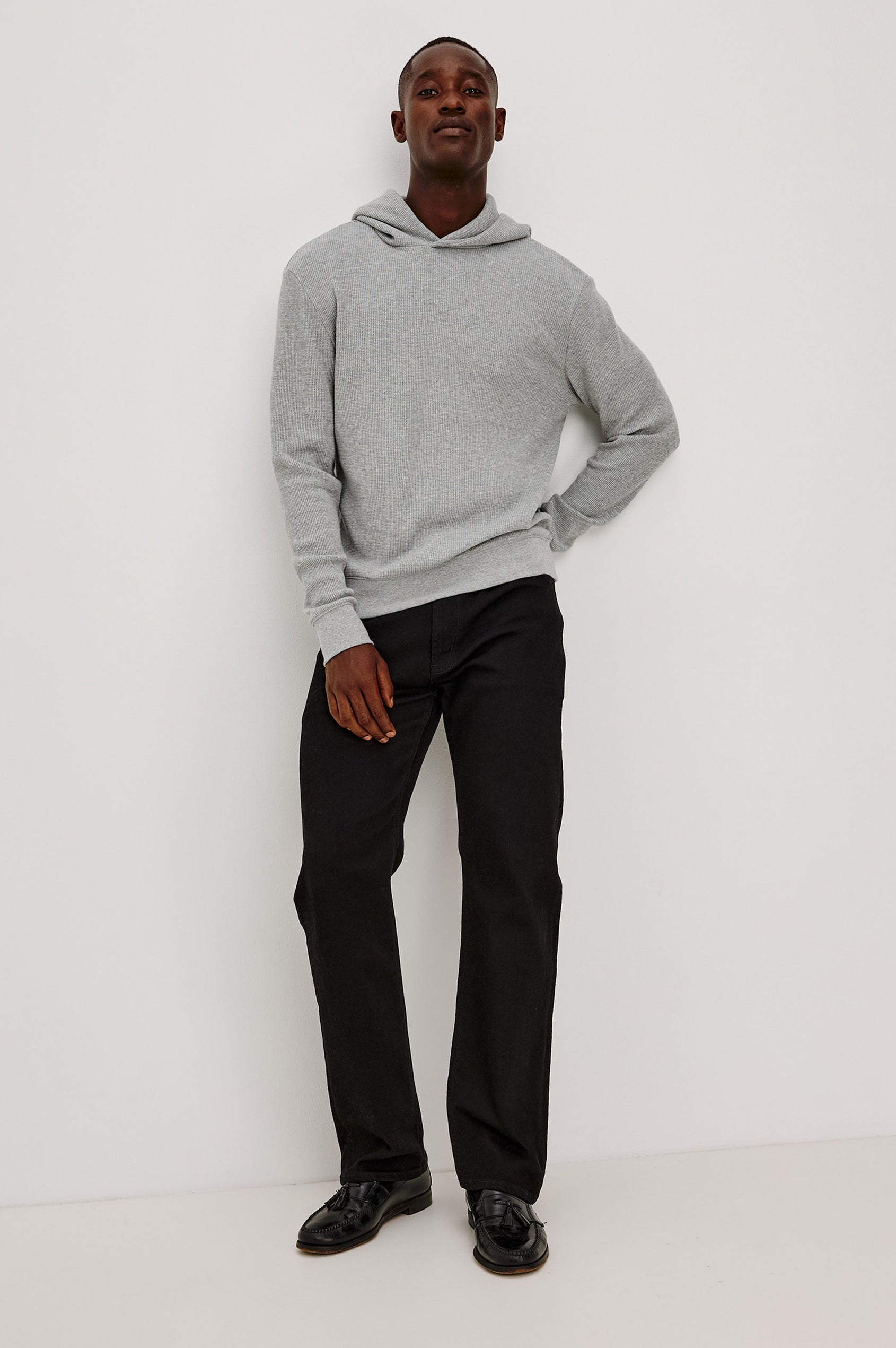 Gates Hoodie in Micro-Waffle Cotton Blend With Fixed Hood, Long Sleeves, and Relaxed Fit in Heather Grey Colorway - Full Body Front View Featured on Model