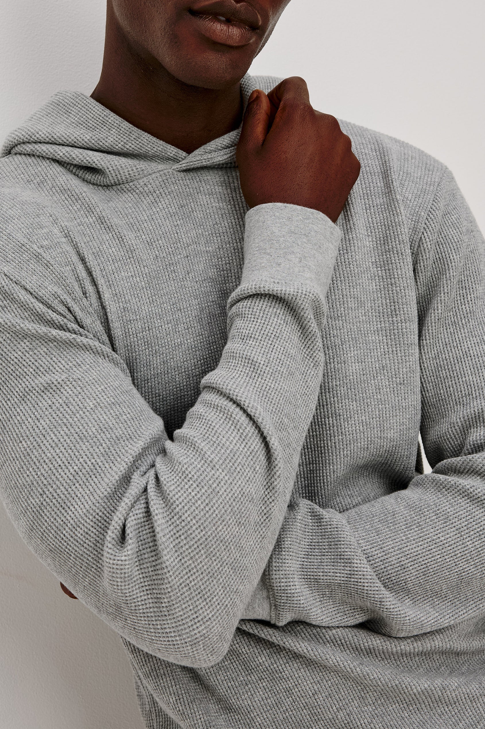 Gates Hoodie in Micro-Waffle Cotton Blend With Fixed Hood, Long Sleeves, and Relaxed Fit in Heather Grey Colorway - Upper Body Front View Featured on Model
