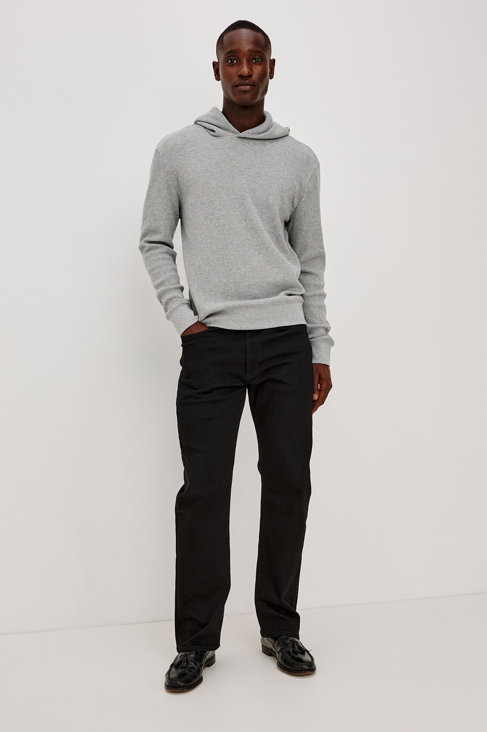 Gates Hoodie in Micro-Waffle Cotton Blend With Fixed Hood, Long Sleeves, and Relaxed Fit in Heather Grey Colorway - Full Body Front View Featured on Model