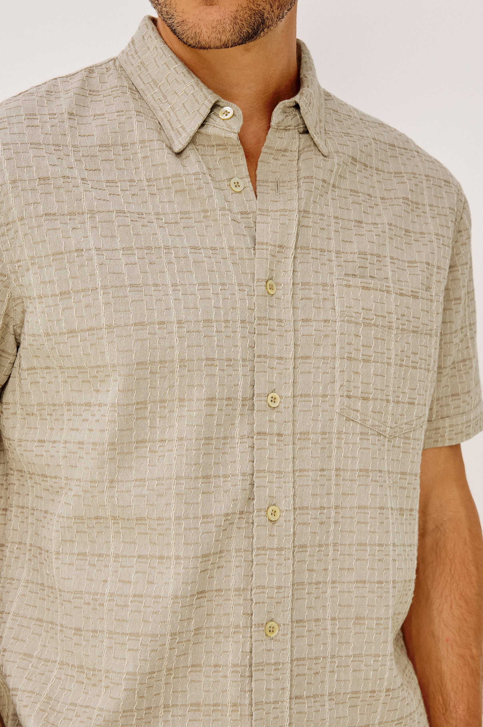 Gavin Button-Up Shirt in Linen Blend With Collar, Short Sleeves, Chest Patch Pocket, and Classic Fit in Taupe Cream Twist Colorway - Detailed Front View Featured on Model