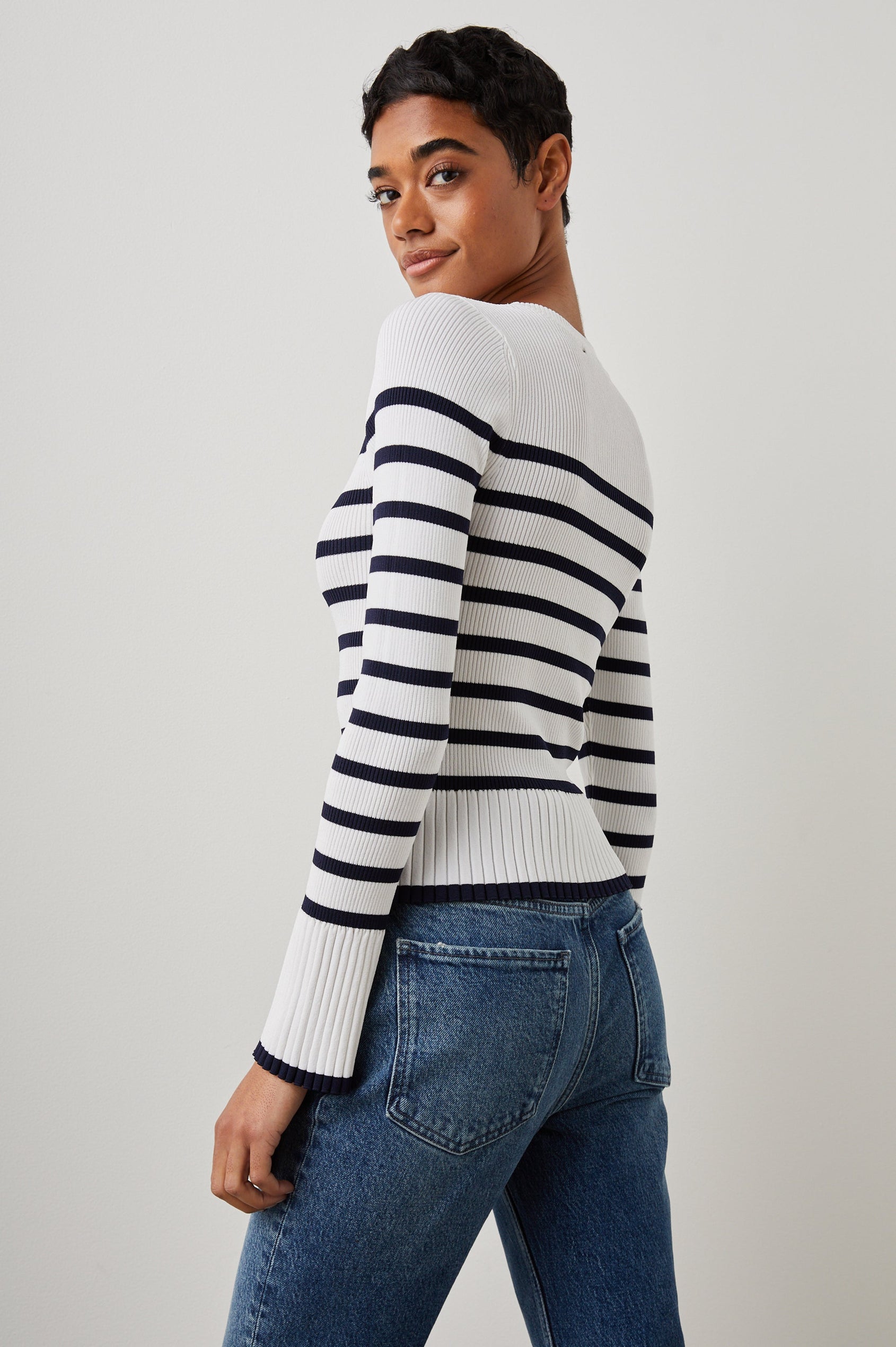 Gemma Ribbed Long-Sleeve Sweater with a Crew Neck in Ivory Navy Stripe Colorway, Horizontal Stripes - Side View Featured on Model 