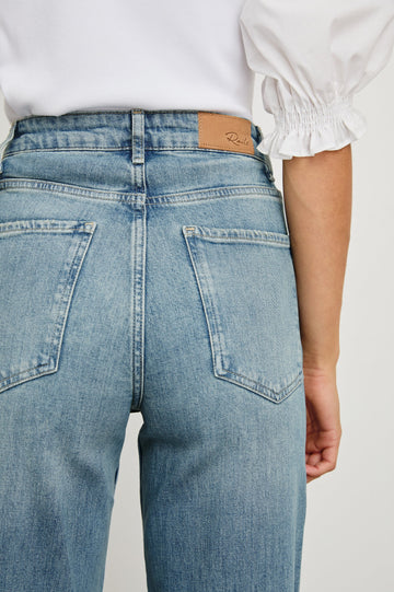 Getty Wide Leg Denim Pants with Cuffed Hems, Belt Loops, Two Front Pockets and Two Back Patch Pockets in Baltic Sea Cuffed Colorway - Back View Featured on Model