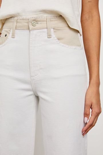 Getty cropped wide leg jean with blanket stiching and dual tones in Crema Embroidered - close up of details on model