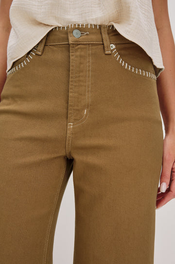 Getty cropped wide leg jean with contrast white blanket stitching in Safari Embroidered Colorway. Front Detail View of Model Shown.