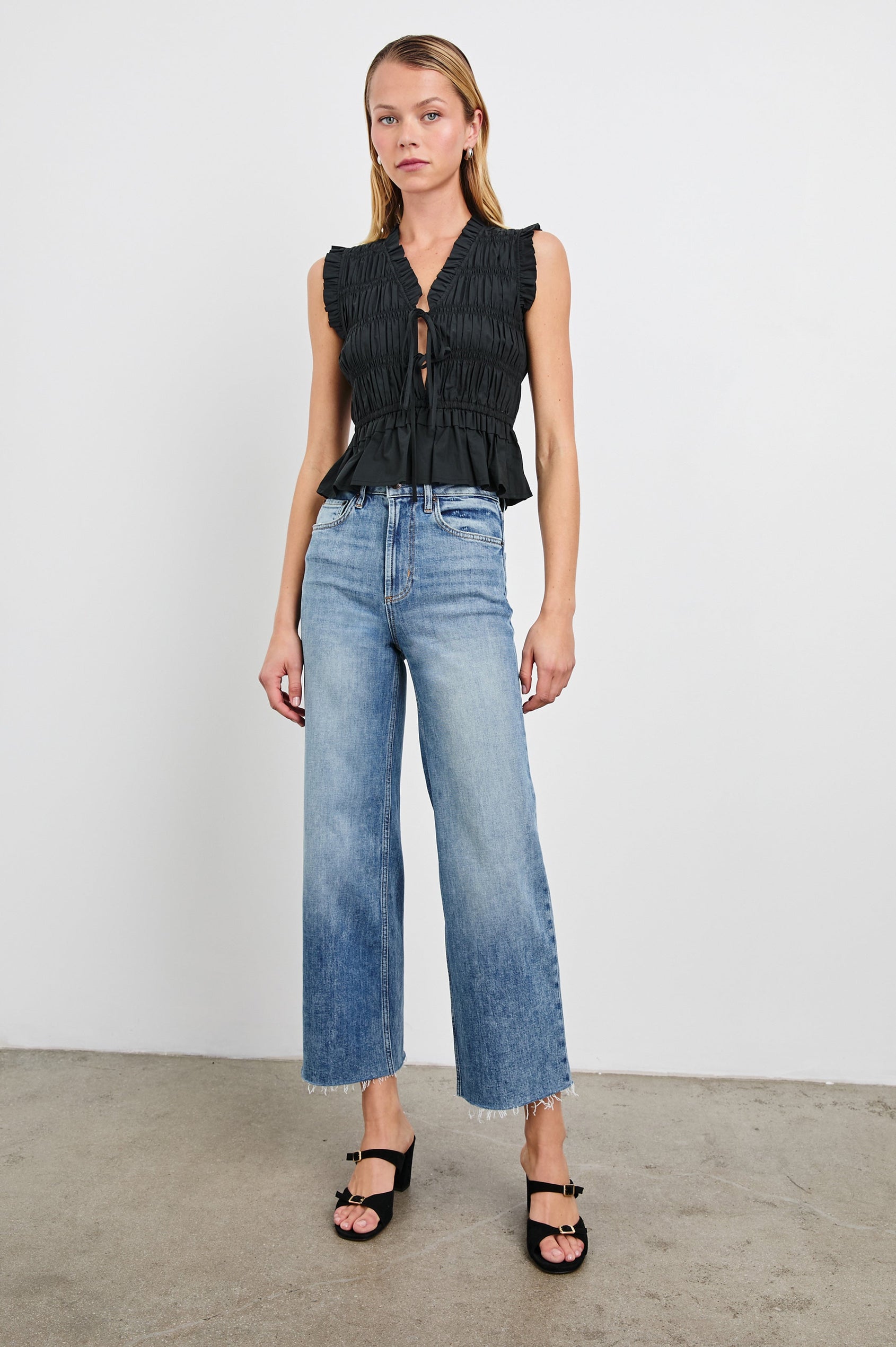 Getty cropped 5-pocket wide leg jean with in Tradewind, a medium wash. Front full body view featured on model.