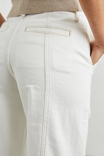 Getty Crop Utility Wide Leg Denim Pants with Belt Loops, Additional Seams, Two large Front Pockets and Two Back Patch Pockets in Vintage Ecru Contrast Stitch Colorway, gold-toned Seam Stitching - Back View Featured on Model