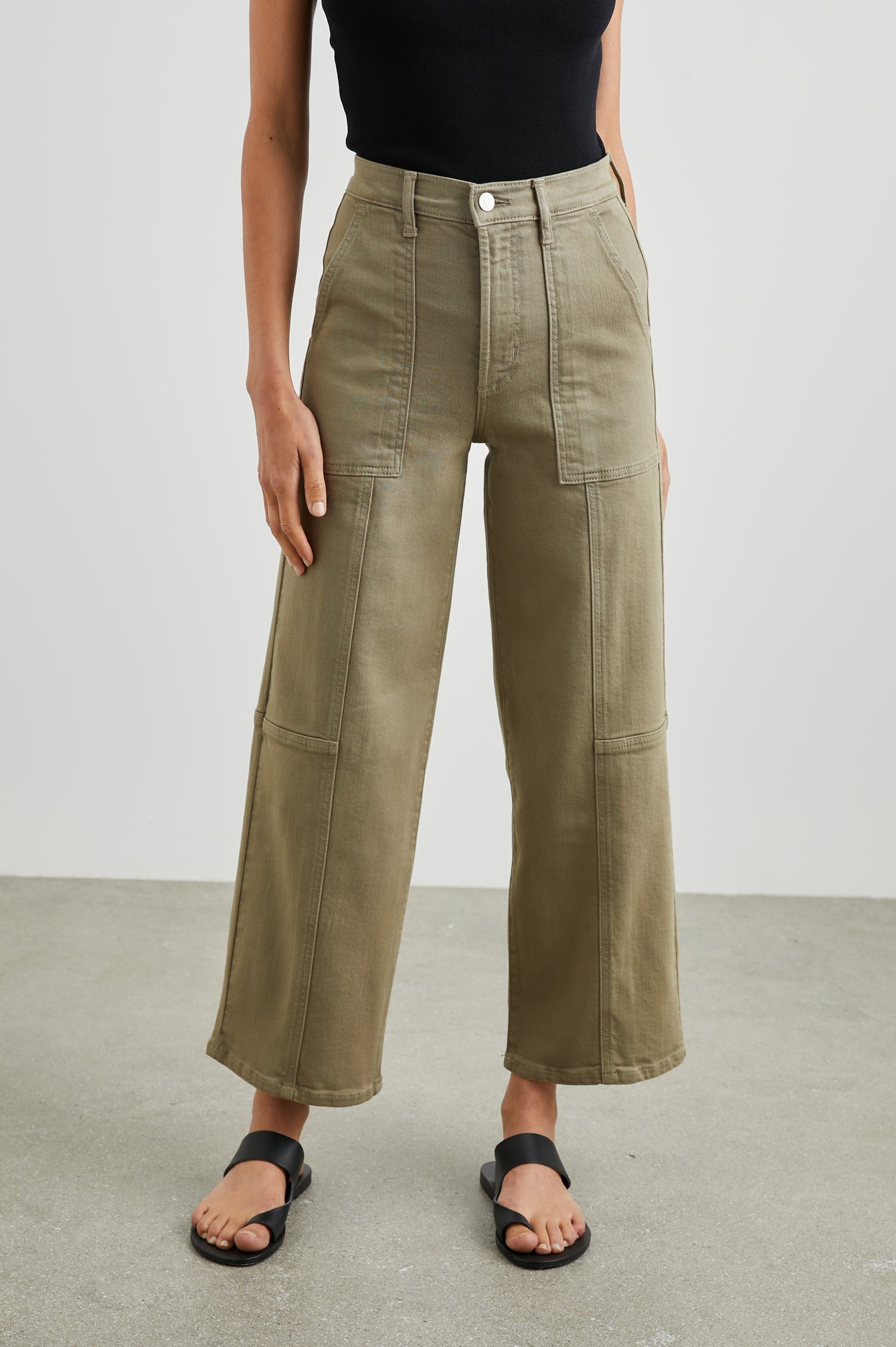 Getty Crop Utility Wide Leg Denim Pants with Belt Loops, Additional Seams, Two large Front Pockets and Two Back Patch Pockets in Washed Olive Colorway - Front View Featured on Model
