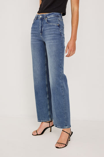 Getty Wide Leg Denim Pants with Belt Loops, Two Front Pockets and Two Back Patch Pockets in East Coast Colorway - Front/Side View Featured on Model