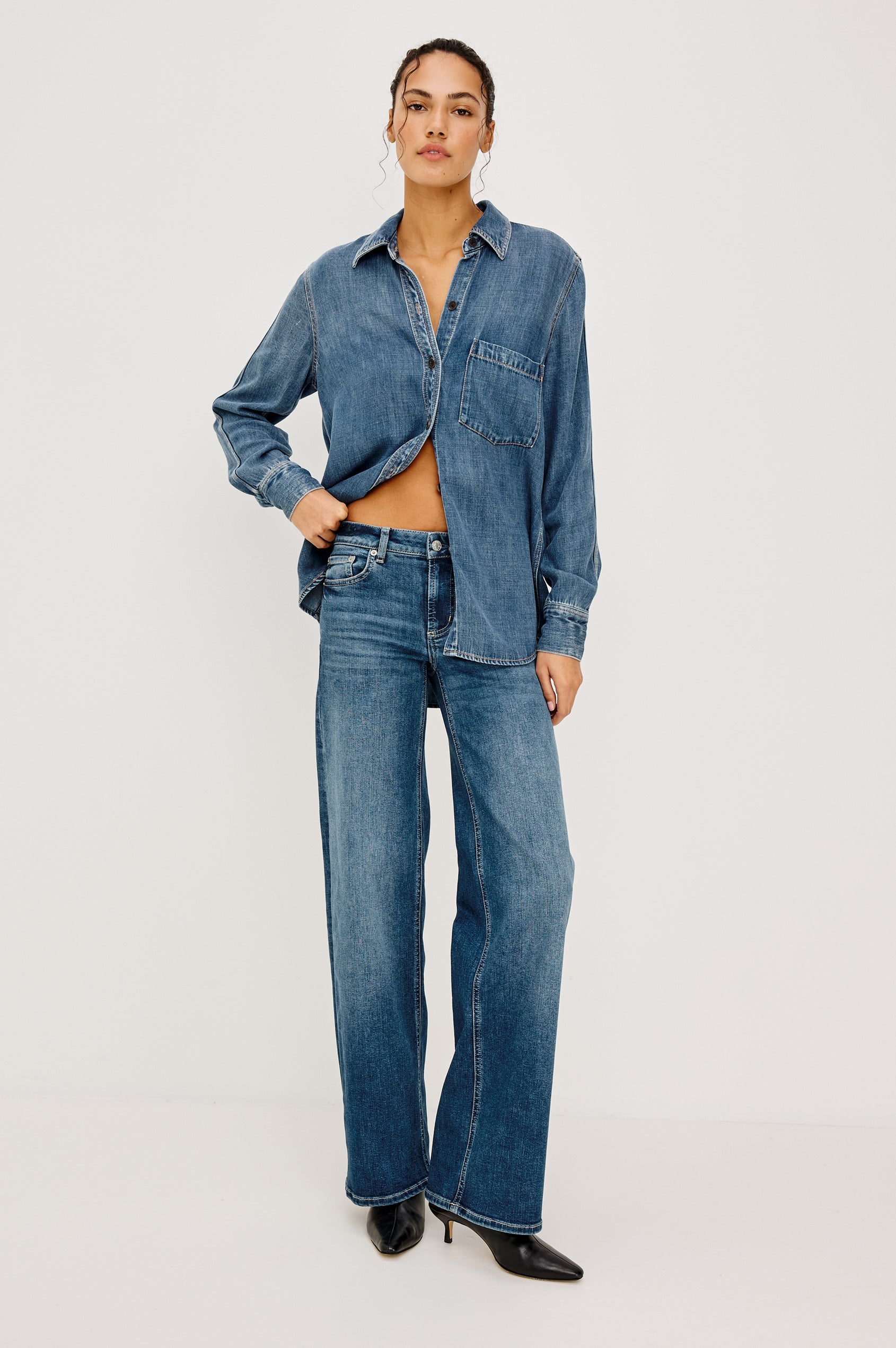 Getty Low Rise Wide Straight Leg Jean in HIgh Stretch Denim With 5-Pockets, Zip Fly, and 31″ Inseam in Lagoon Colorway - Full Body Front View Featured on Model