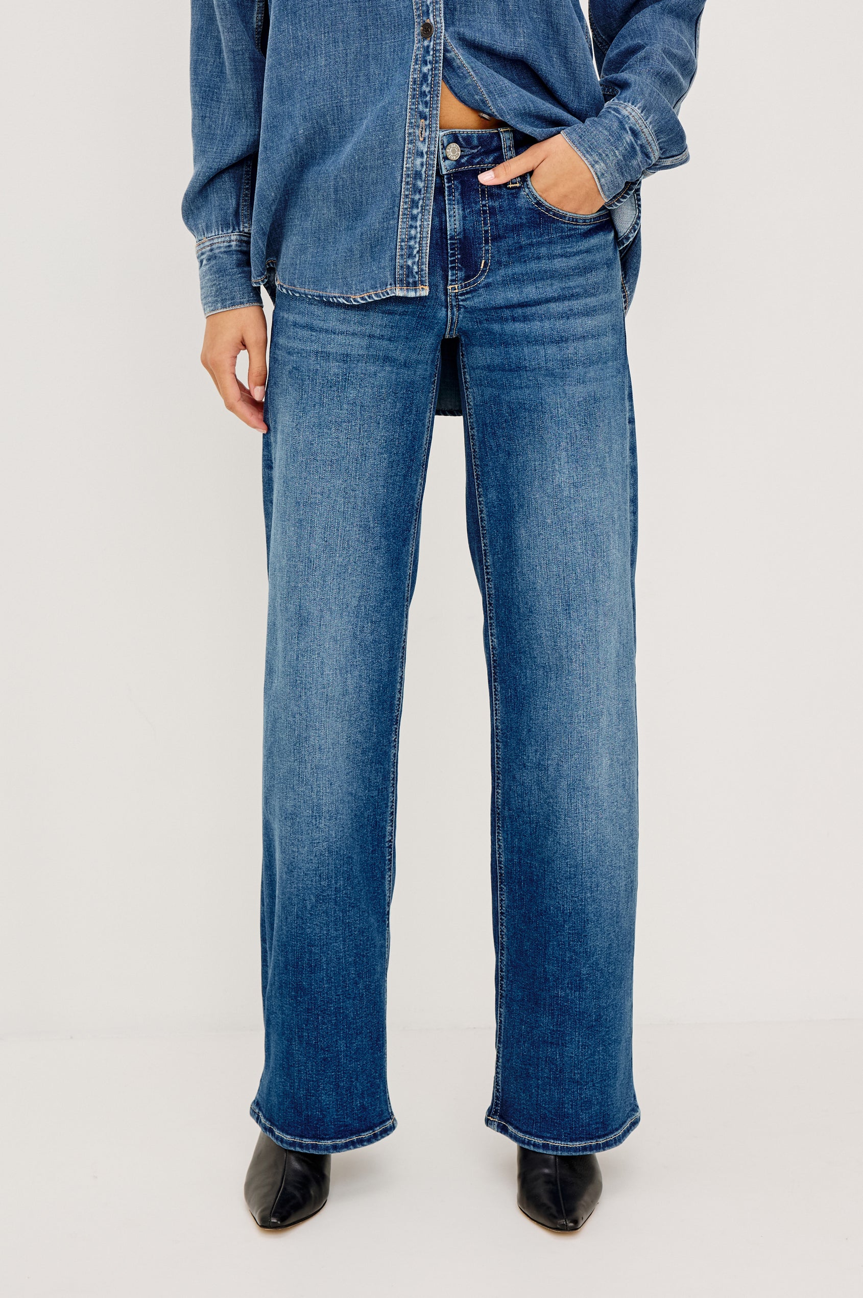 Getty Low Rise Wide Straight Leg Jean in HIgh Stretch Denim With 5-Pockets, Zip Fly, and 31″ Inseam in Lagoon Colorway - Lower Body Front View Featured on Model