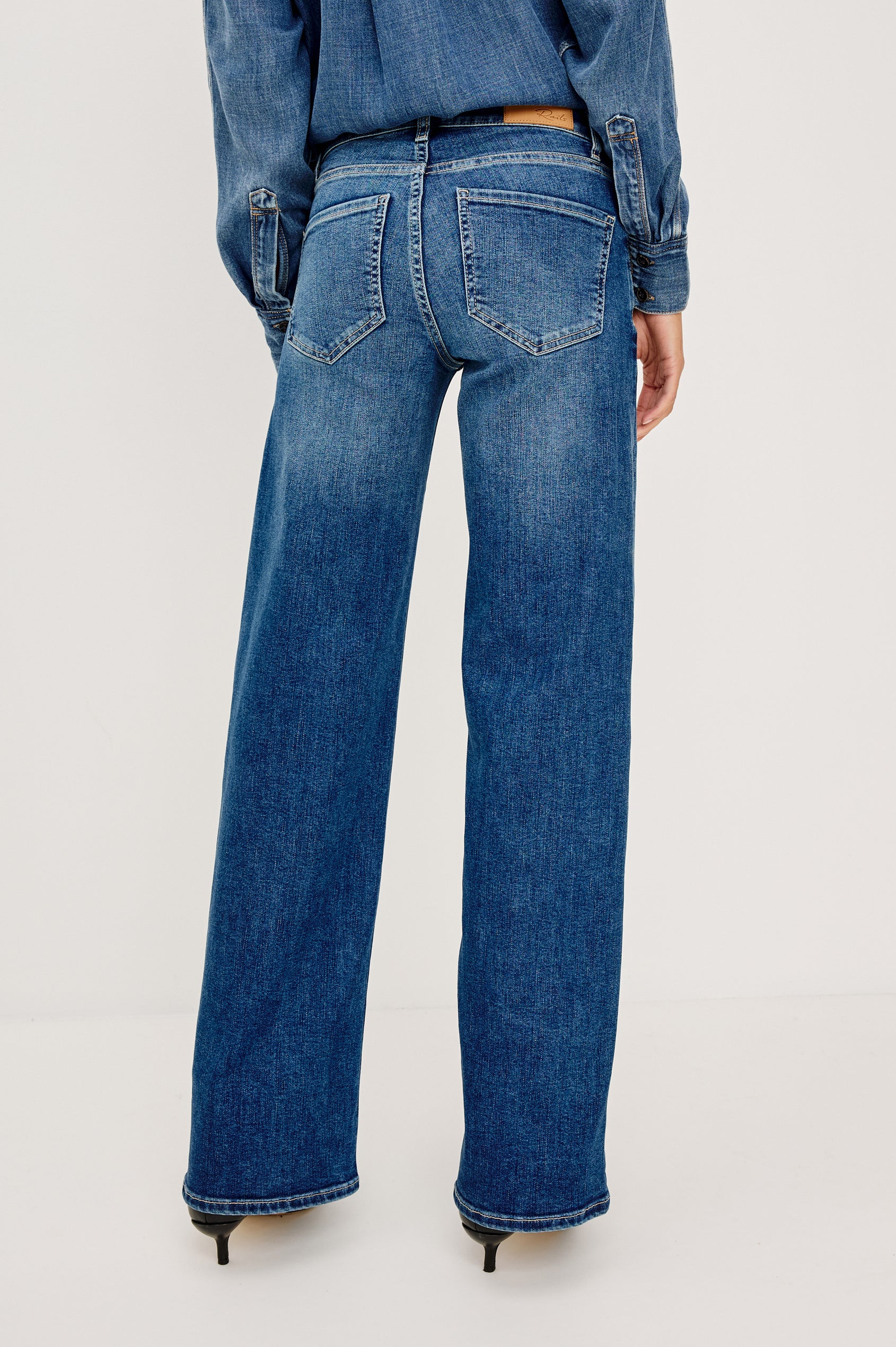 Getty Low Rise Wide Straight Leg Jean in HIgh Stretch Denim With 5-Pockets, Zip Fly, and 31″ Inseam in Lagoon Colorway - Lower Back Body Back View Featured on Model