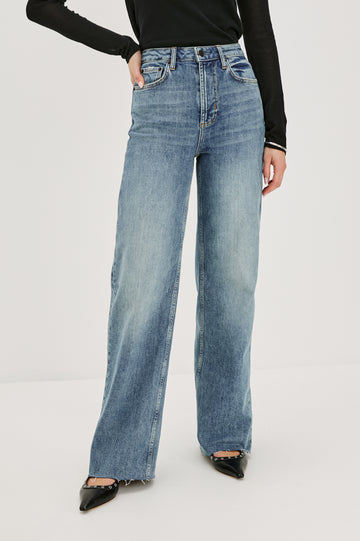Getty full length 5-pocket wide leg jean in Tradewind colorway, a medium wash. Front view featured on model.