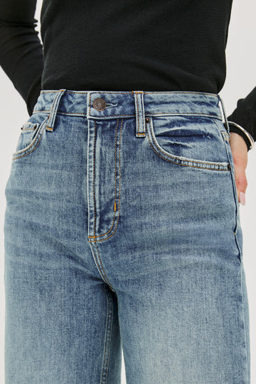 Getty full length 5-pocket wide leg jean in Tradewind colorway, a medium wash. Front detail view featured on model.