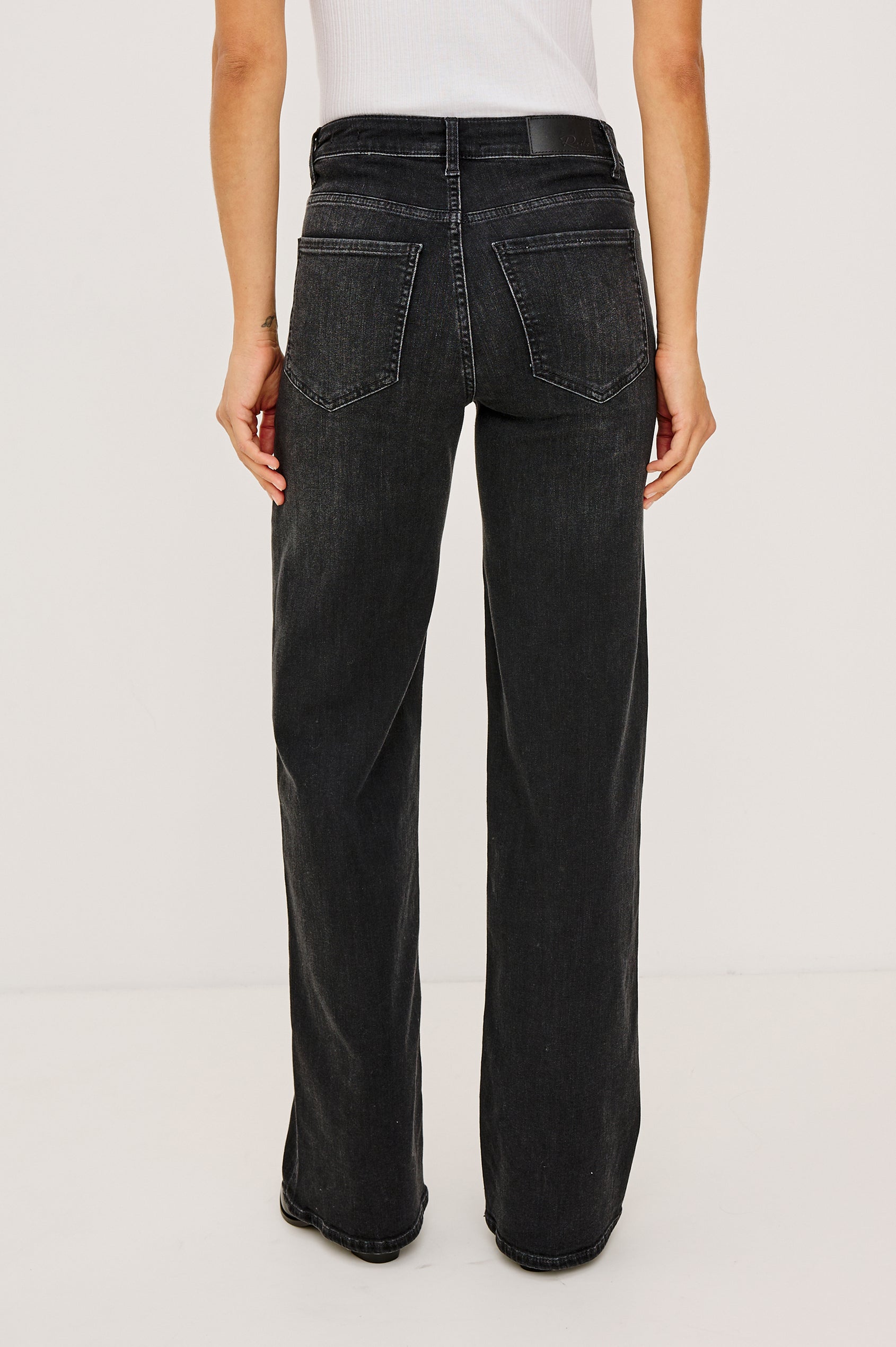 Getty Wide Leg Jean in Light Stretch Denim With 5-Pockets in Vintage Black Colorway - Lower Body Back View Featured on Model
