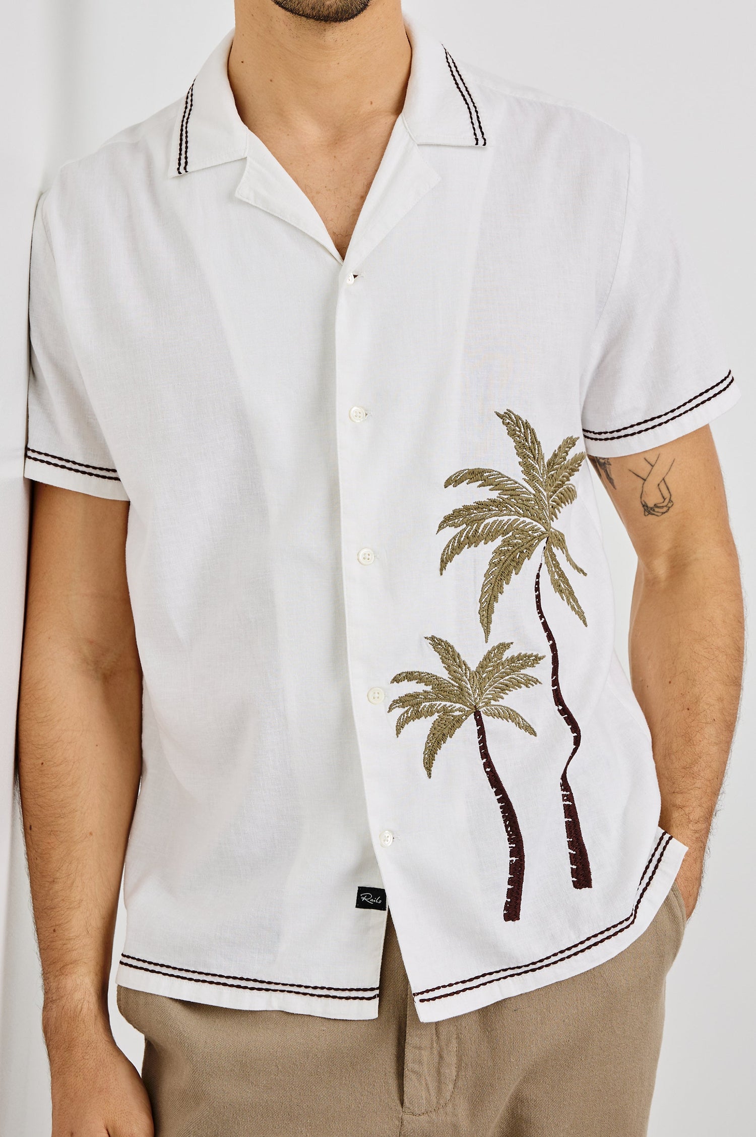 Gibson Collared Button Front Shirt with Short Sleeves, embroidered detail and Contrast Brown Stitching in White Brown Palm Colorway. Front View Shown on Model.