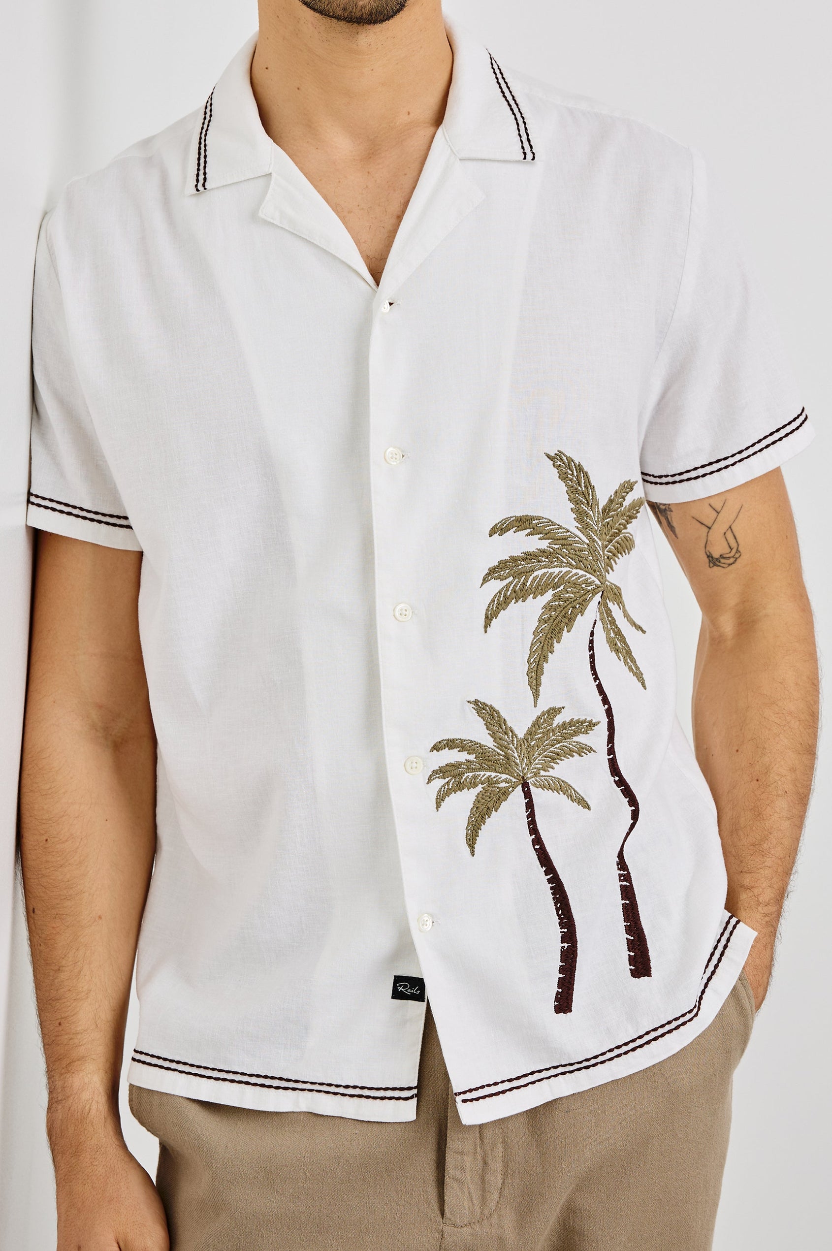 Gibson Collared Button Front Shirt with Short Sleeves, embroidered detail and Contrast Brown Stitching in White Brown Palm Colorway. Front View Shown on Model.