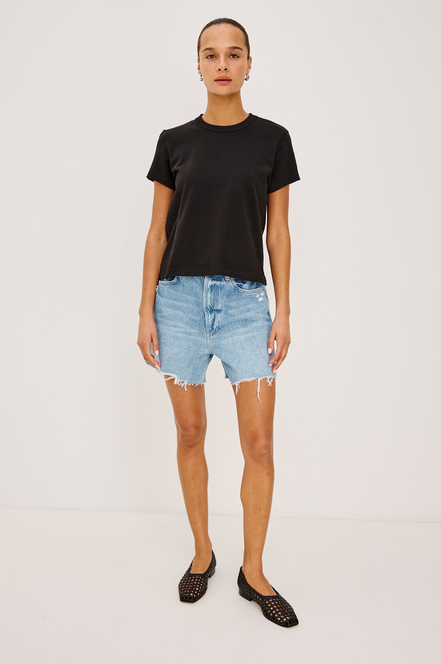 Girlfriend T-Shirt in Pleated Jersey With Slightly Boxy, Cropped Silhouette in Black Colorway - Full Body Front View Featured on Model