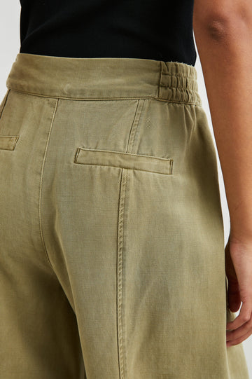 Greer Pants with Two Large Front Pockets, Two Back Welt Pockets and Vertical Seams Down the Front and Back Legs in Canteen Colorway - Back View Featured on Model 