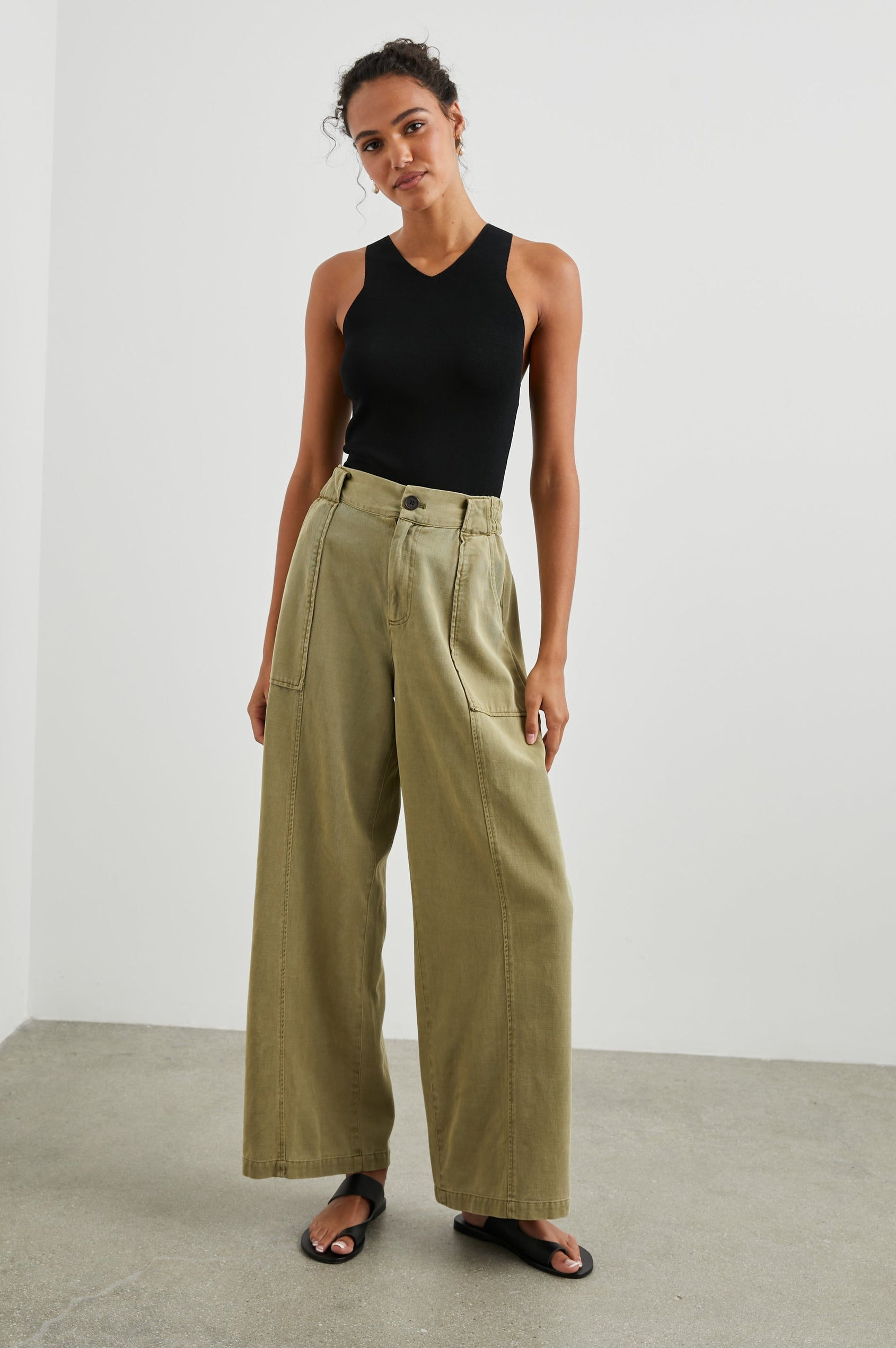 Greer Pants with Two Large Front Pockets, Two Back Welt Pockets and Vertical Seams Down the Front and Back Legs in Canteen Colorway - Front Full Body View Featured on Model 