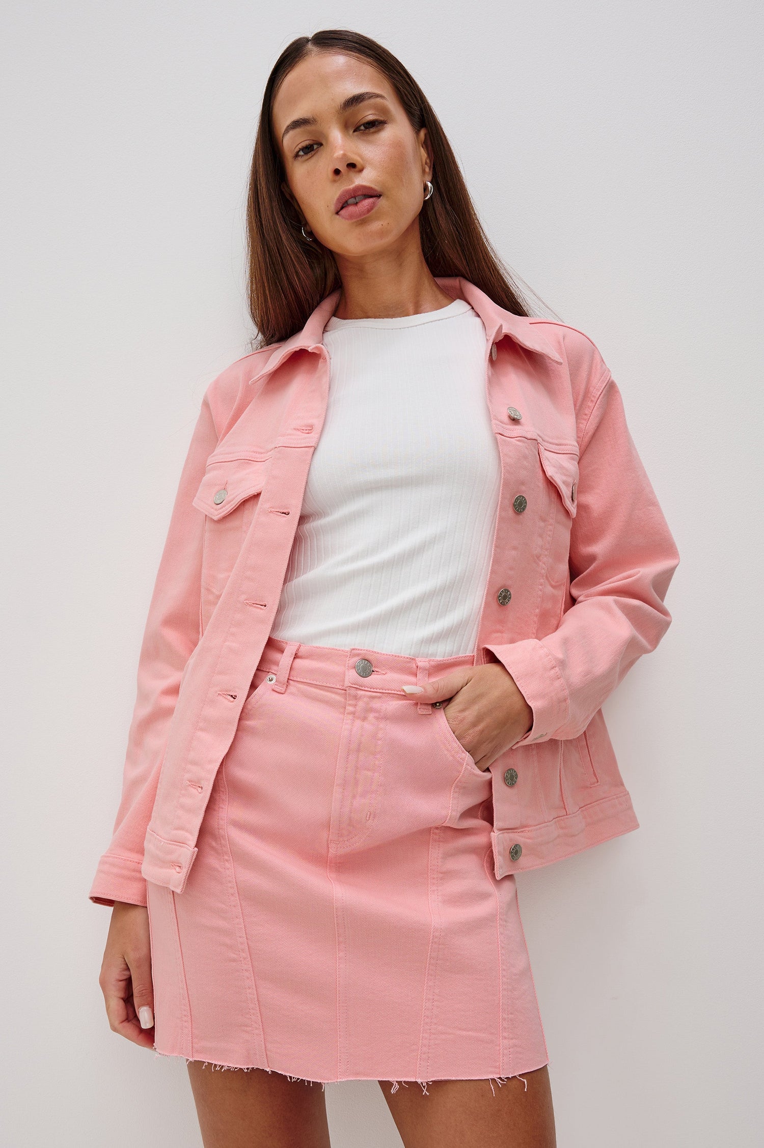 Grove Oversized Denim Trucker Jacket with Button Front and Chest Flap Pockets in Bubblegum Colorway. Front View of Model Shown.