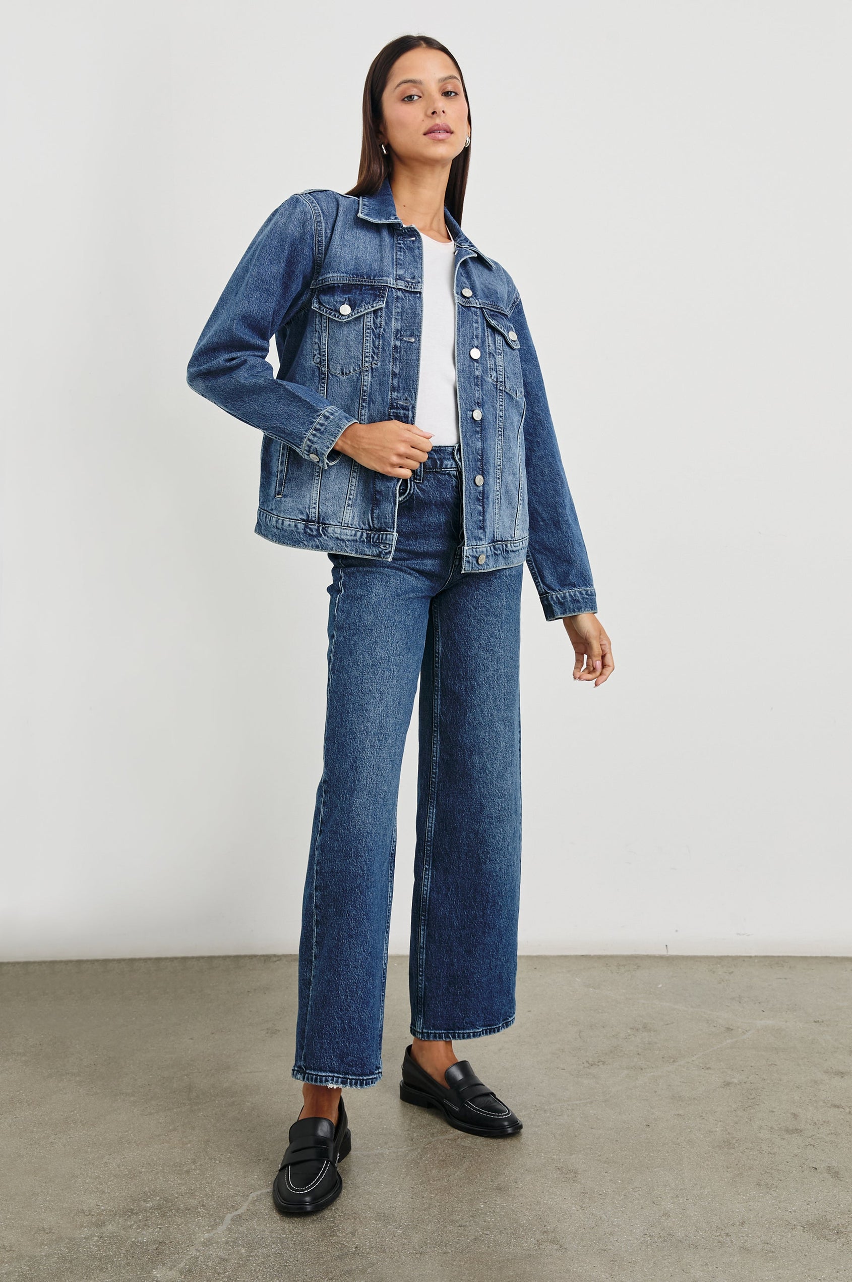 Grove Boyfriend Trucker Denim Jacket with Button Closure, Two Front Pockets, Two Chest Button Flap Pockets, Front Vertical Seams in Indigo Haze Colorway - Front Full Body View Featured on Model  
