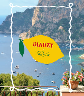 Scenic view of a coastal area with mountains and boats, featuring the Giadzy logo.