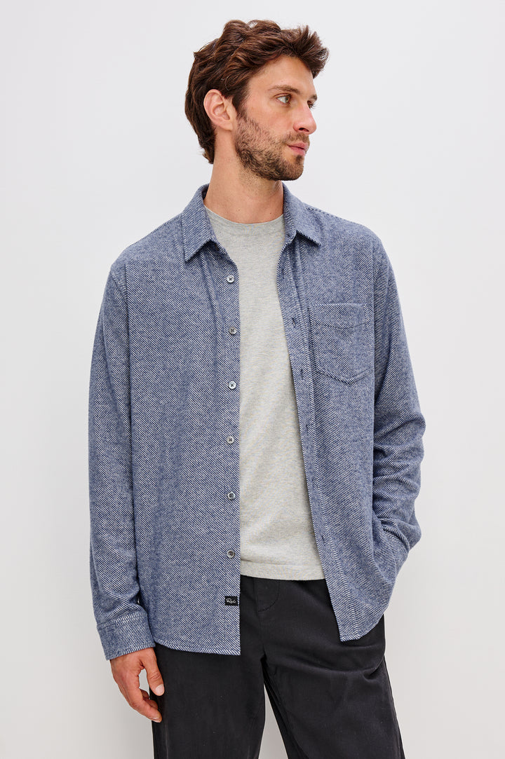 Hawke Long Sleeve Button Front Shirt with a Chest Pocket in Marine Twill Colorway. Front Unbuttoned View Featured on Model.