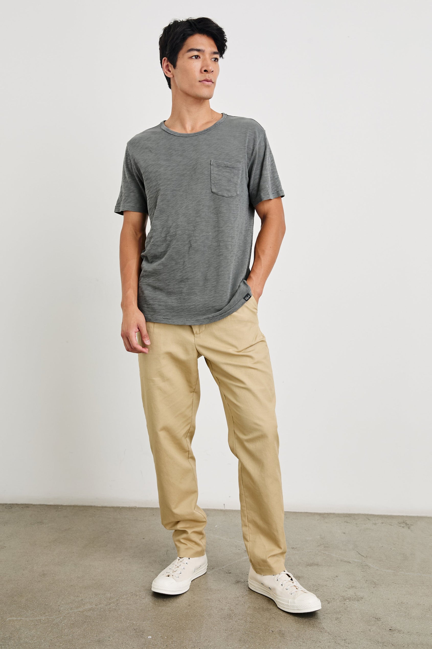Hawthorne Pants with Belt Loops, Two Front Pockets and Back Welt Pockets in Khaki Colorway - Front Full Body View Featured on Model 