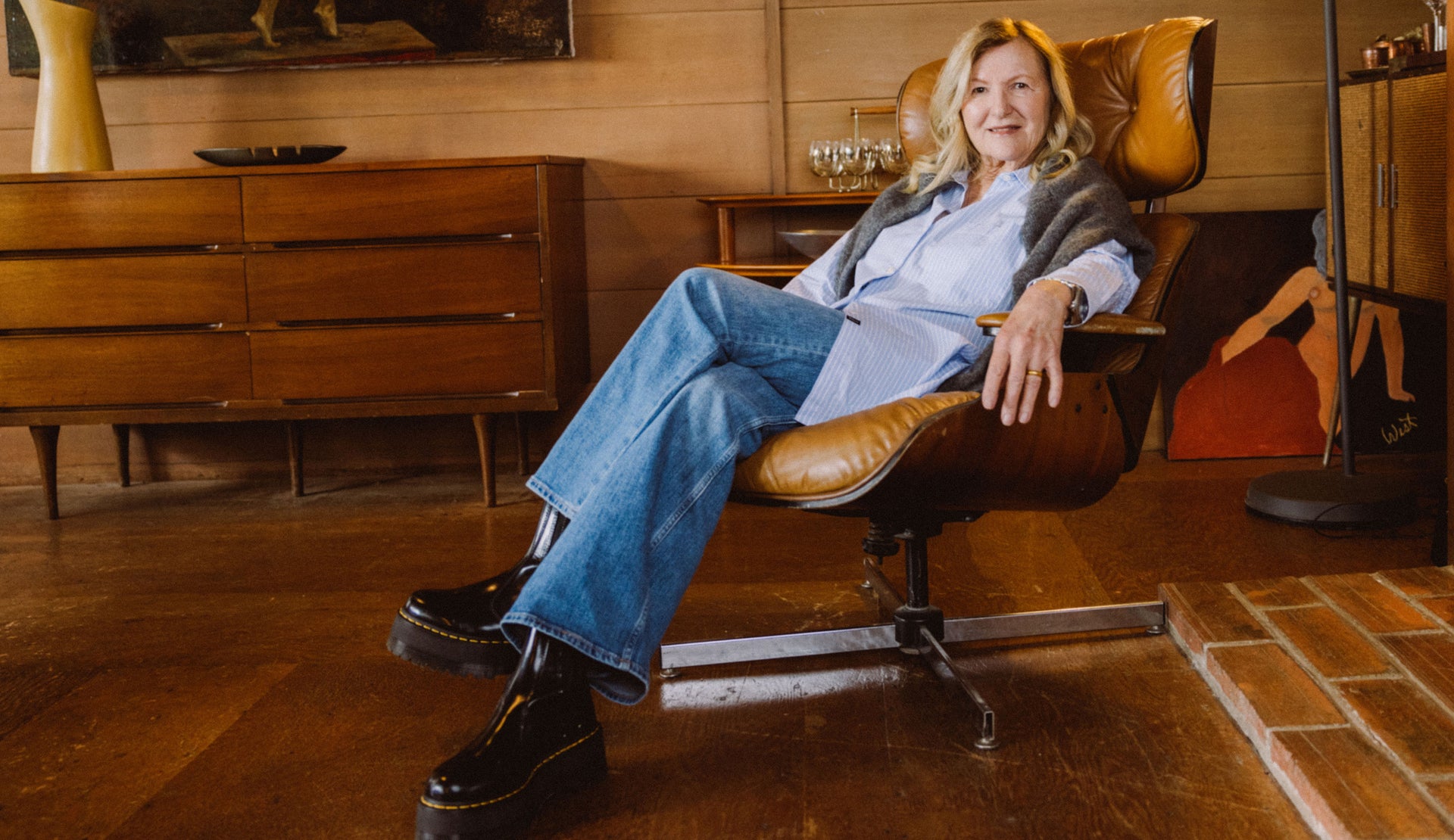 FEMALE WEARING ELSA SHIRT (LONG SLEEVE OVERSIDED BUTTON UP SHIRT) IN COLOR OXFORD WHITE STRIPE (LIGHT BLUE WITH WHITE VERTICAL STRIPES) AND GETTY WIDE LEG JEANS IN COLOR TIDAL WAVE (LIGHT WASH DENIM)