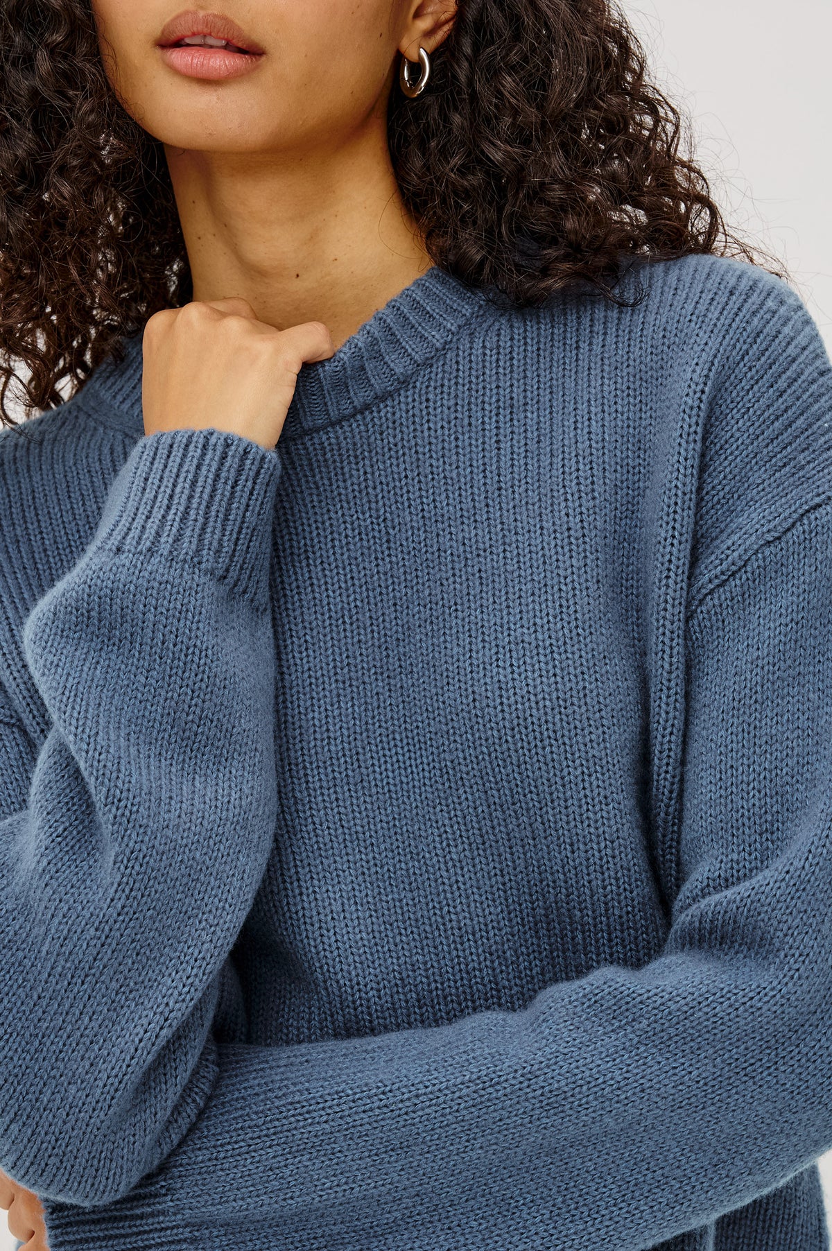 Helly Sweater in Wool-Cashmere Blend With Crew Neckline, Relaxed Boxy Slightly Cropped Fit, Long Sleeves, and Ribbed Trim in Atlantic Colorway - Upper Body Front View Featured on Model