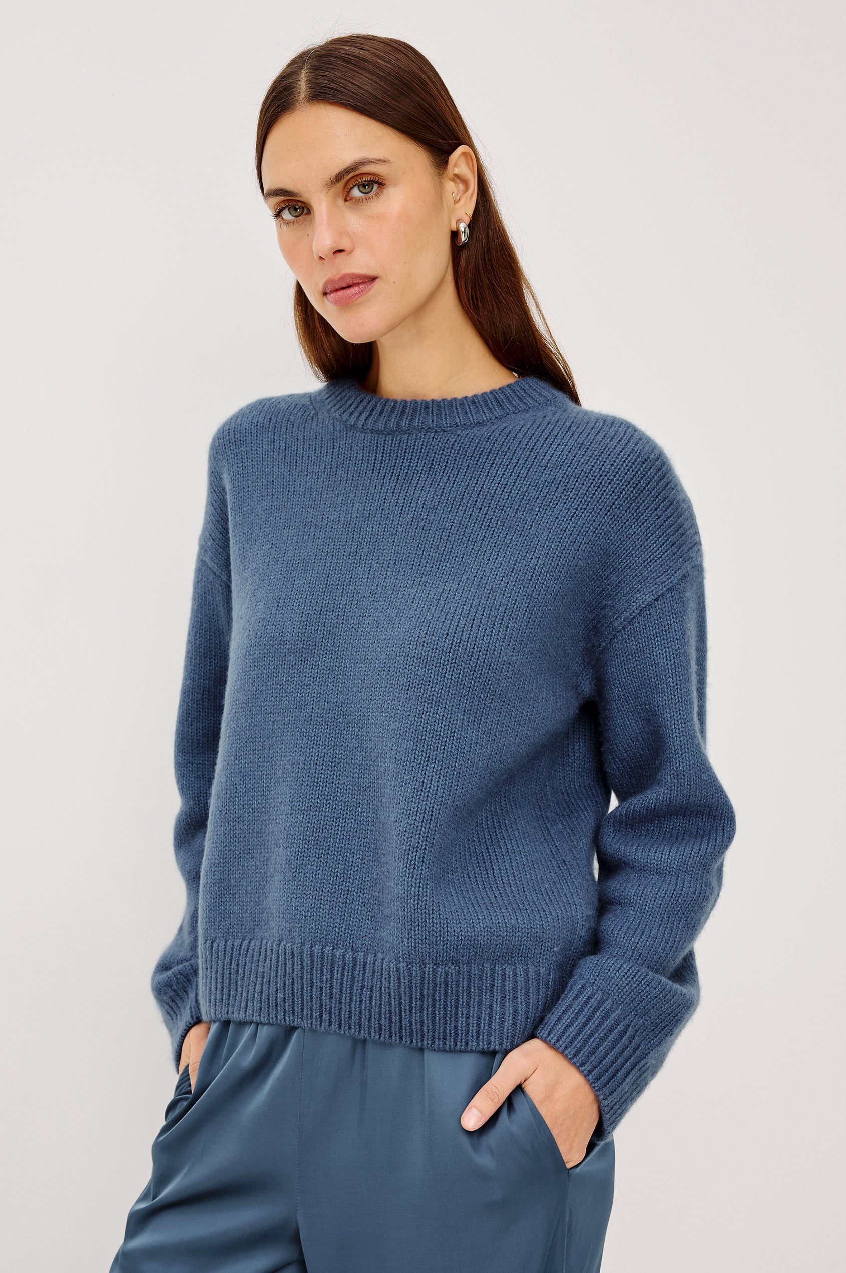 Helly Sweater in Wool-Cashmere Blend With Crew Neckline, Relaxed Boxy Slightly Cropped Fit, Long Sleeves, and Ribbed Trim in Atlantic Colorway - Upper Body Front View Featured on Model