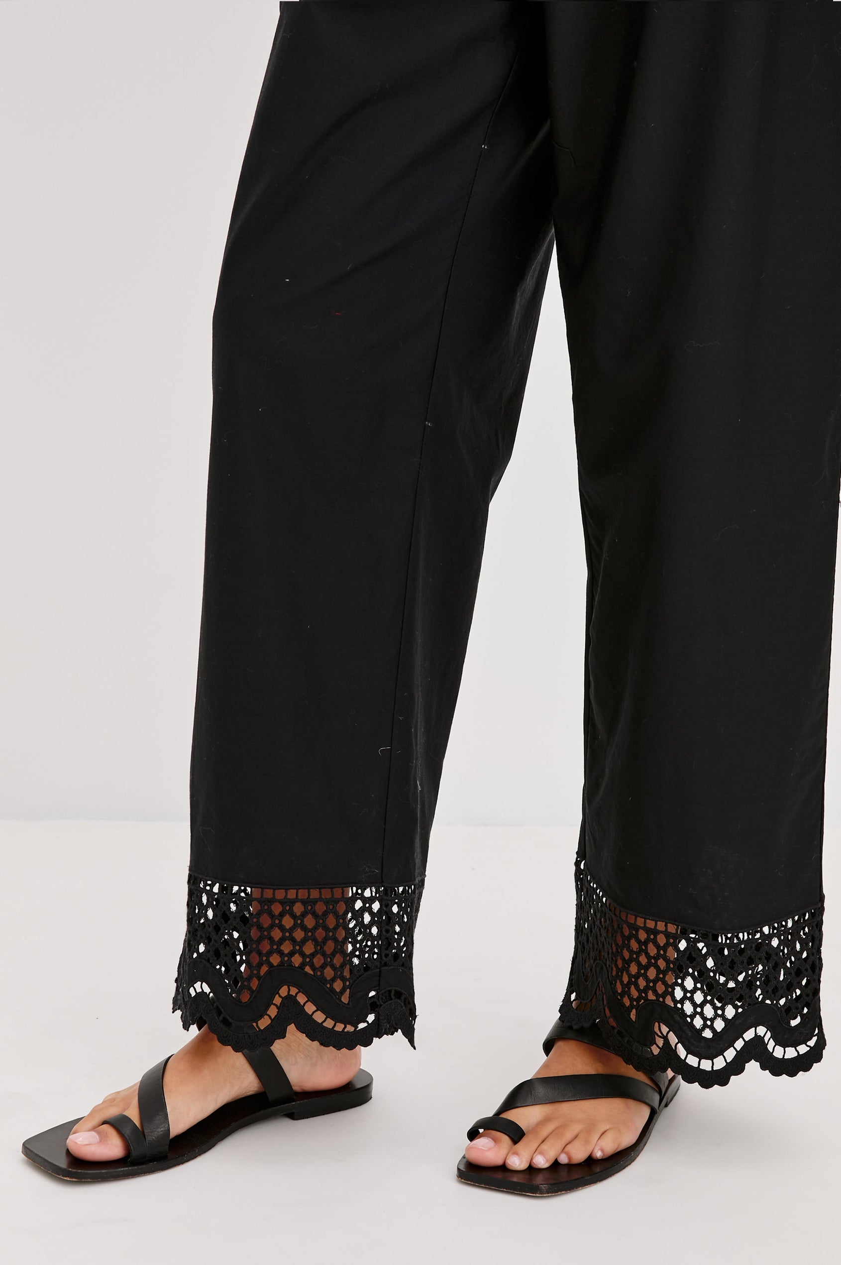 Henrik High Waist Pull on Pant with Smocked Elastic Waistband, Scalloped Embroidered Hem and Front Slash Pockets. Front Detailed View Shown on Model.