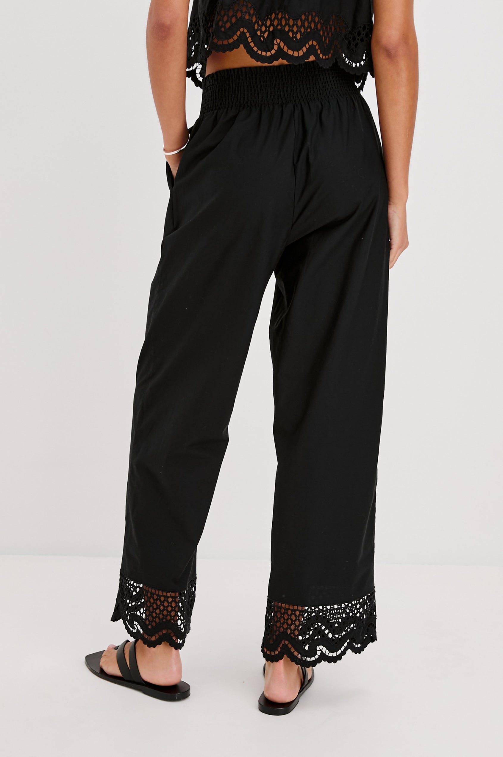 Henrik High Waist Pull on Pant with Smocked Elastic Waistband, Scalloped Embroidered Hem and Front Slash Pockets. Back View Shown on Model.