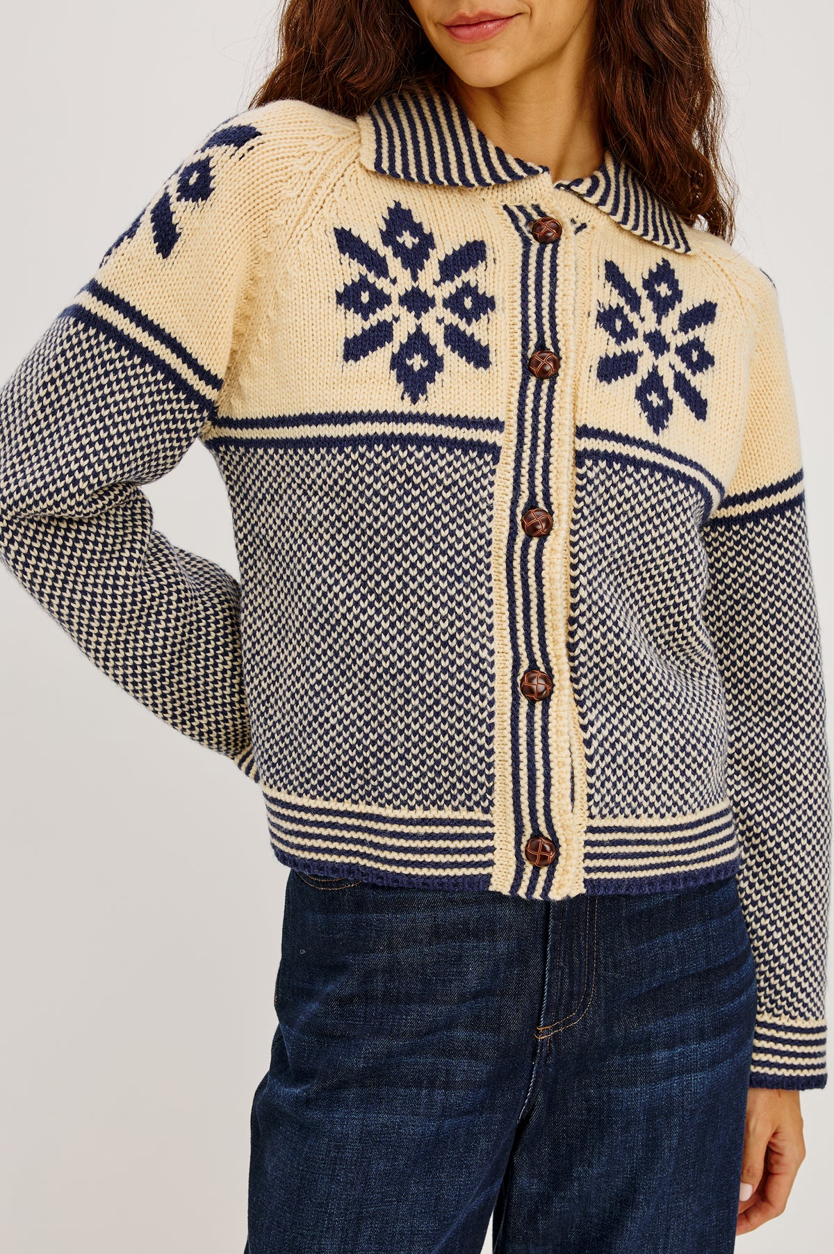 Hilde Cardigan in Fair Isle Jacquard Knit With Relaxed Fit, Wide Collar, Front Buttons, and Long Sleeves in Snowflake Colorway - Upper Body Front Detail View Featured on Model.