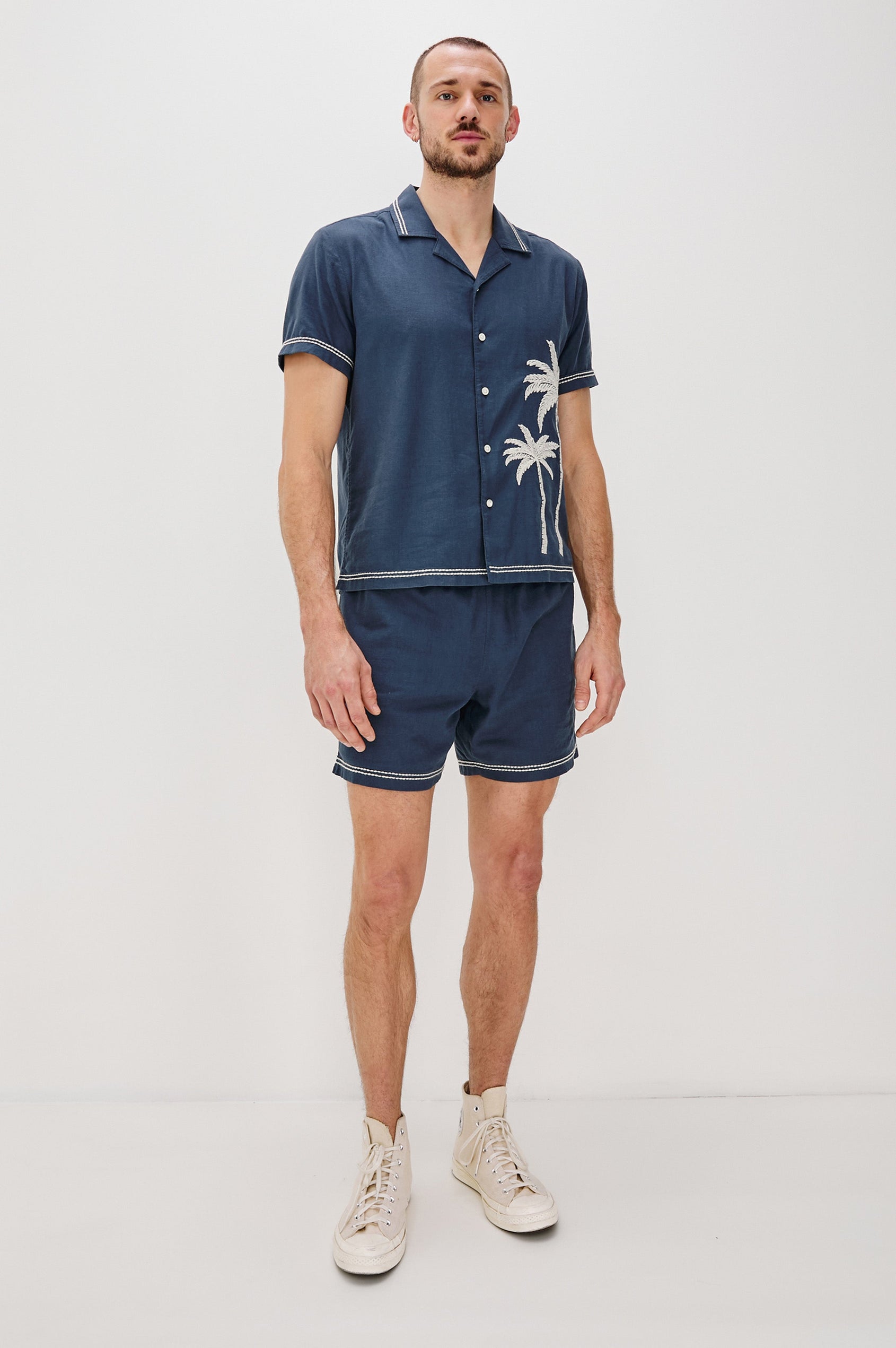 Hudson Elastic Waist Short with a Drawstring Waist, Contrast White Stitching and Side Pockets. Full Body Front View Shown on Model.