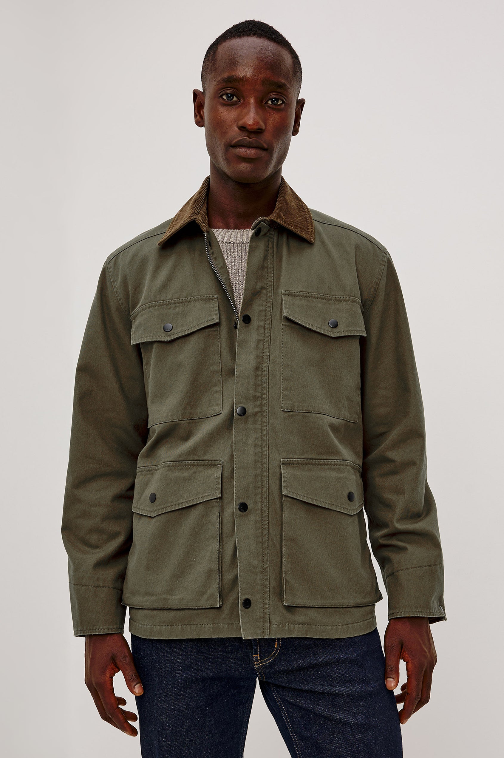 Huntly Jacket in Twill With Plaid Lining, Corduroy Collar, Storm Flap Snap-and-Zip, Four Front Snap Flap Pockets, and Long Sleeves in Highland Colorway - Upper Body Front View Featured on Model