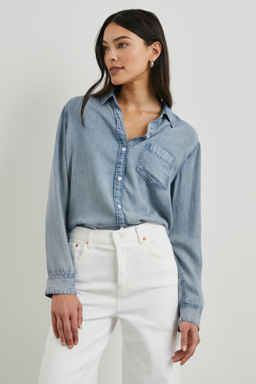 Ingrid Long Sleeve Denim Button Up with a Chest Patch Pocket in Med Vintage Cloud Wash Colorway - Front Tucked View Featured on Model