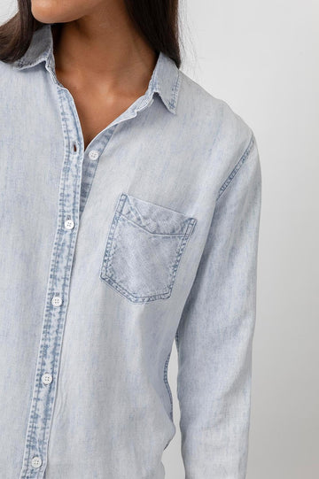 Ingrid Raw Hem, Long Sleeve Denim Button Up with a Chest Patch Pocket in Light Acid Wash Colorway - Front View Featured on Model